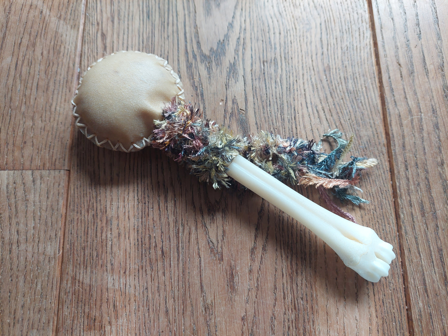 Goat hide and roe deer leg bone rattle