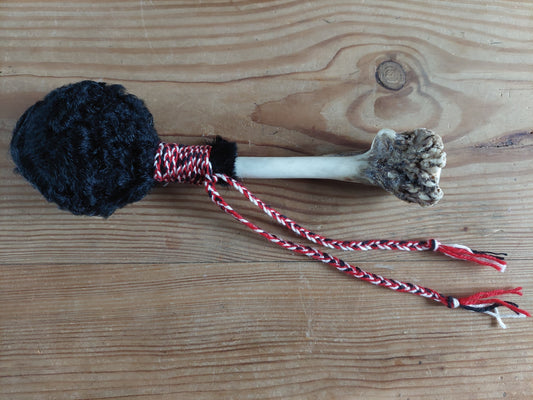 Karakul lamb hide and fallow deer antler rattle
