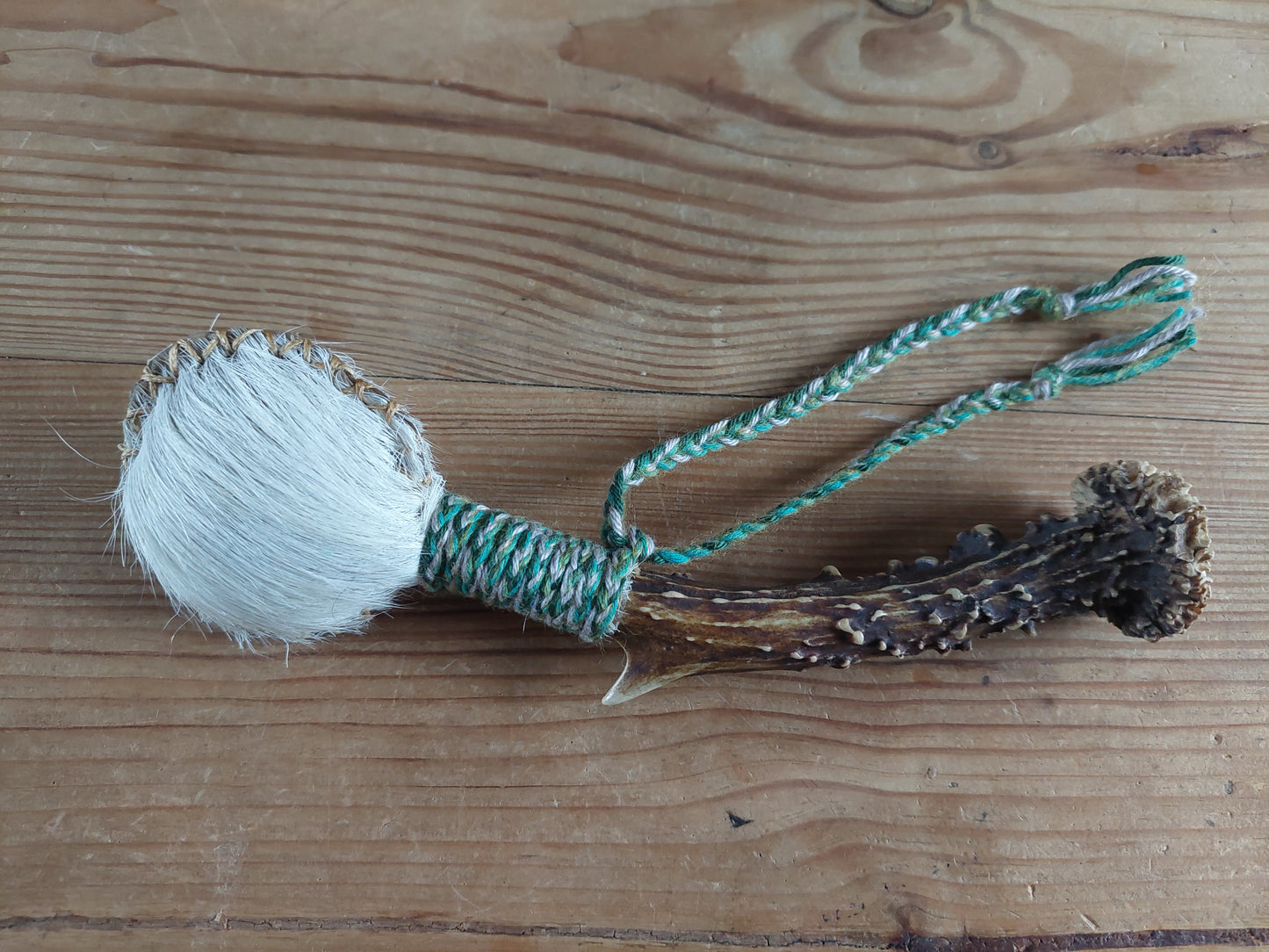 Horse hide and roe deer antler rattle