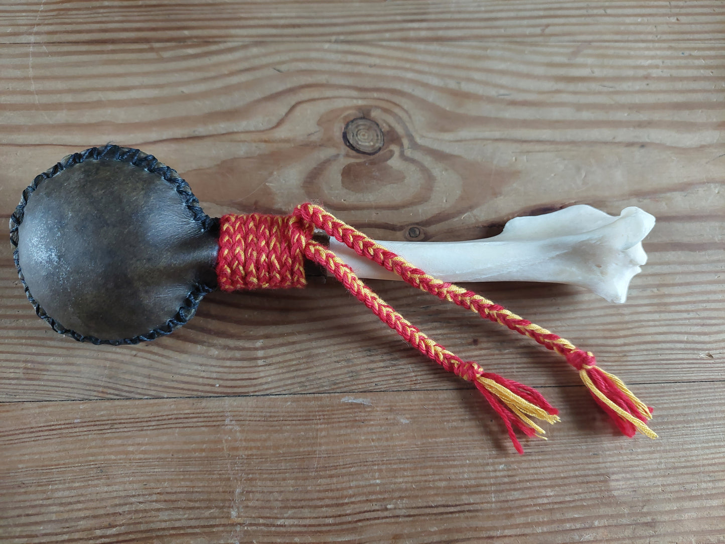 Yak hide and red deer leg bone rattle