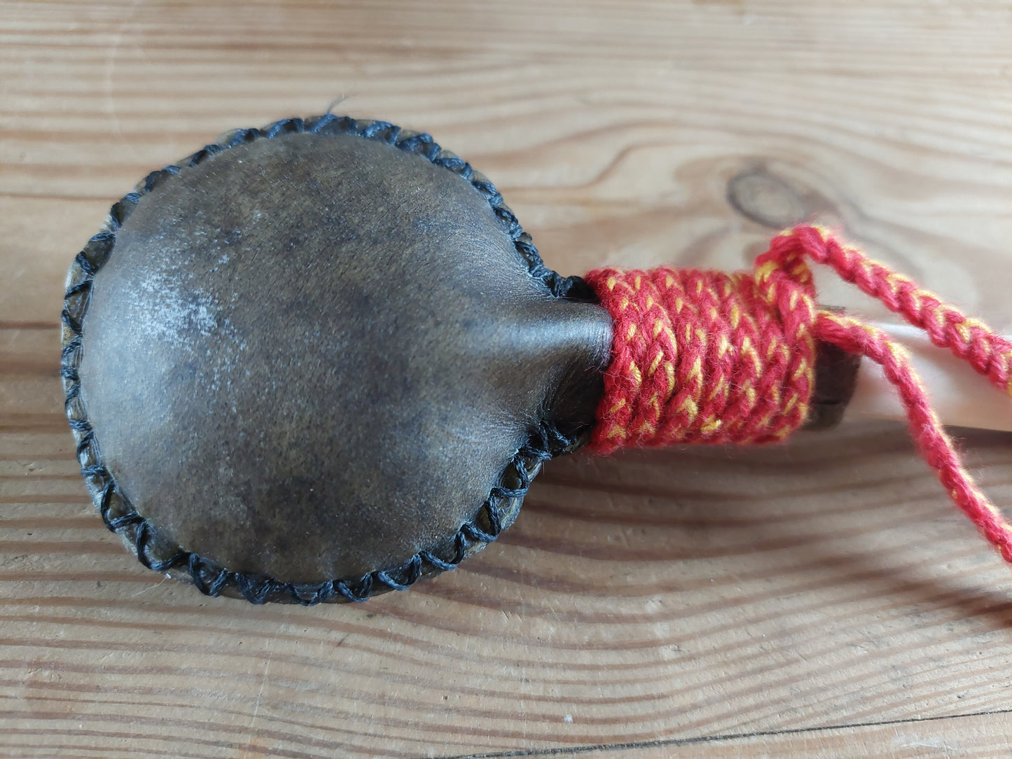 Yak hide and red deer leg bone rattle