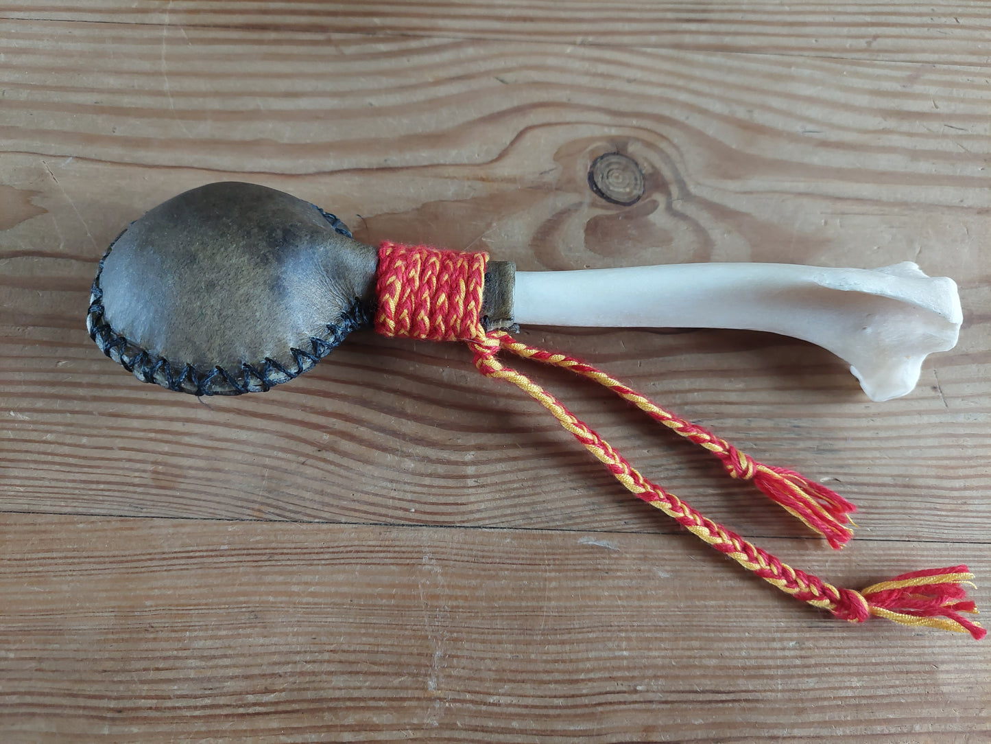 Yak hide and red deer leg bone rattle