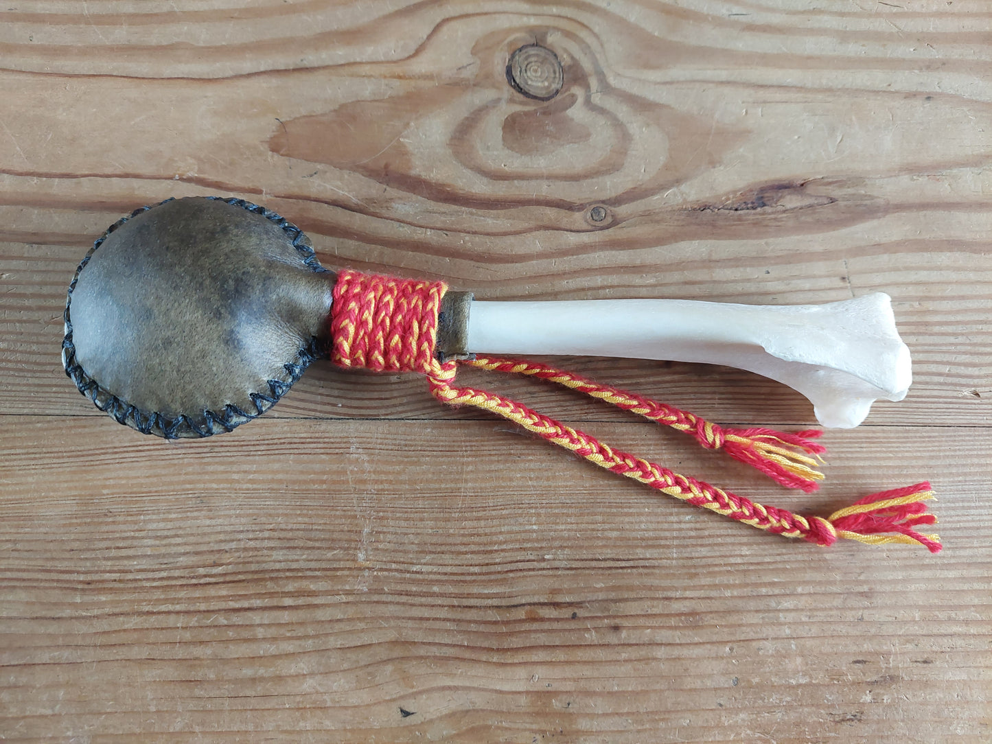 Yak hide and red deer leg bone rattle