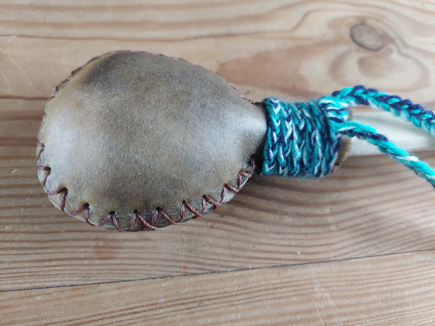 Yak hide and red deer leg bone rattle