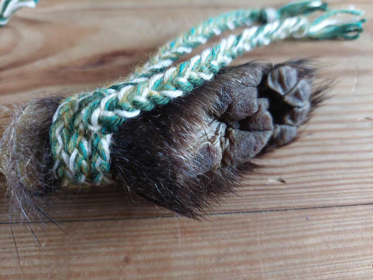 Horse hide, badger paw and pine wood rattle