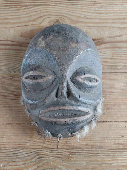 Vintage wooden Tharu tribal festival mask