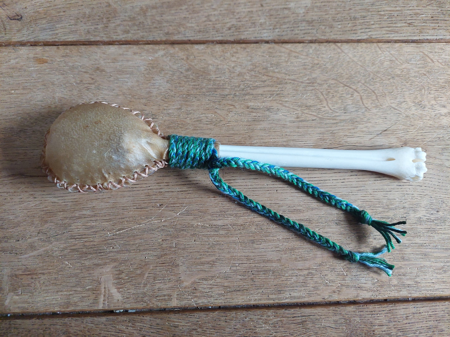 Goat hide and red deer leg bone rattle