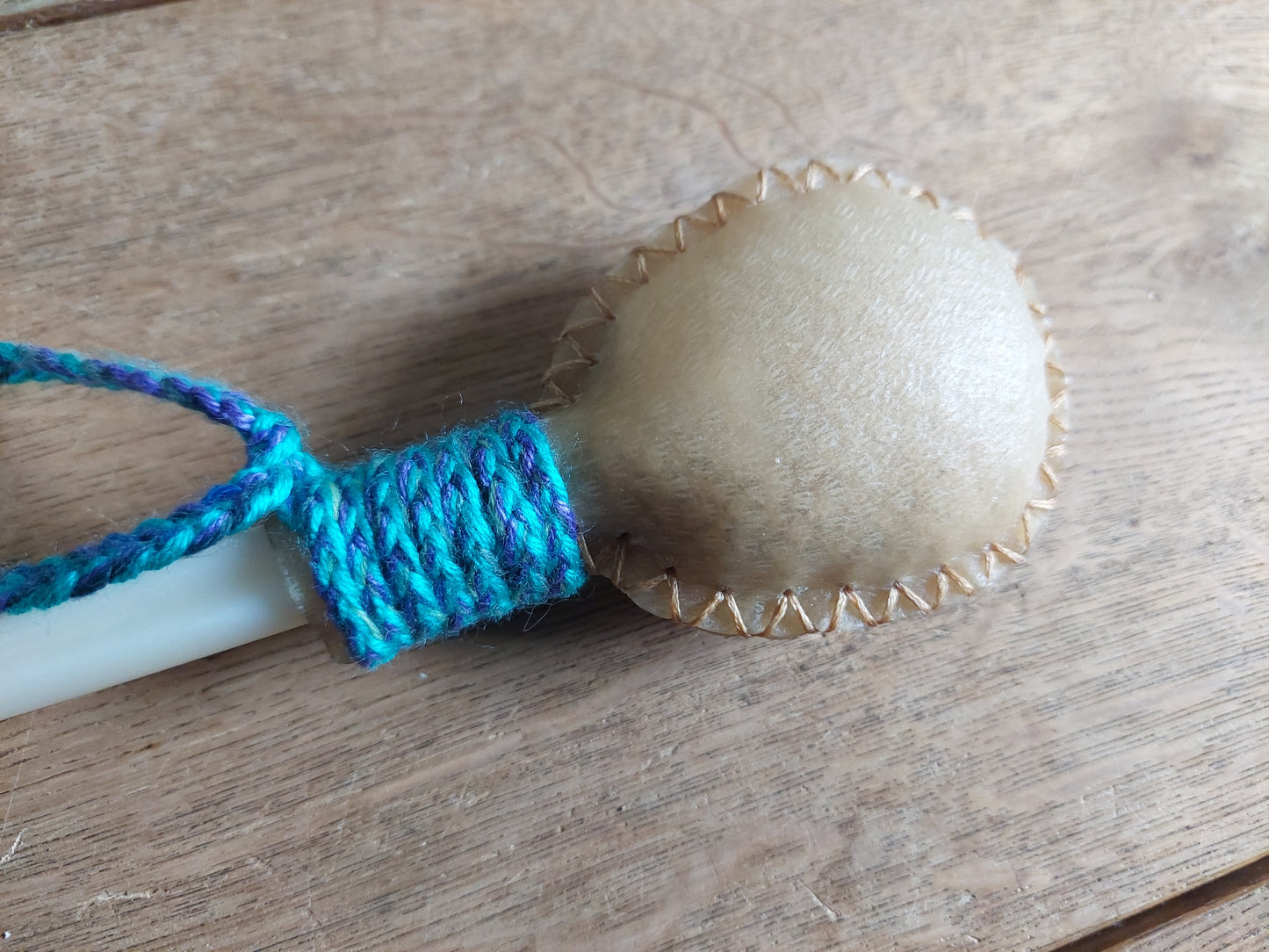 Red deer hide and roe deer leg bone rattle