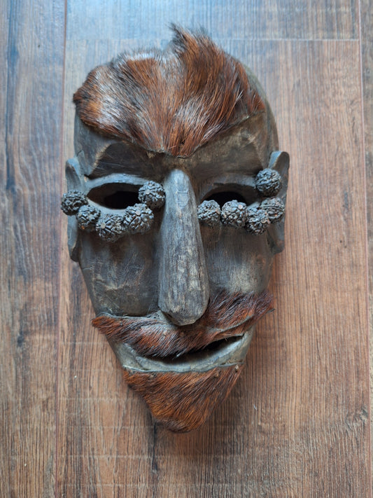 Antique Nepalese wooden mask with rudraksha and yak hide