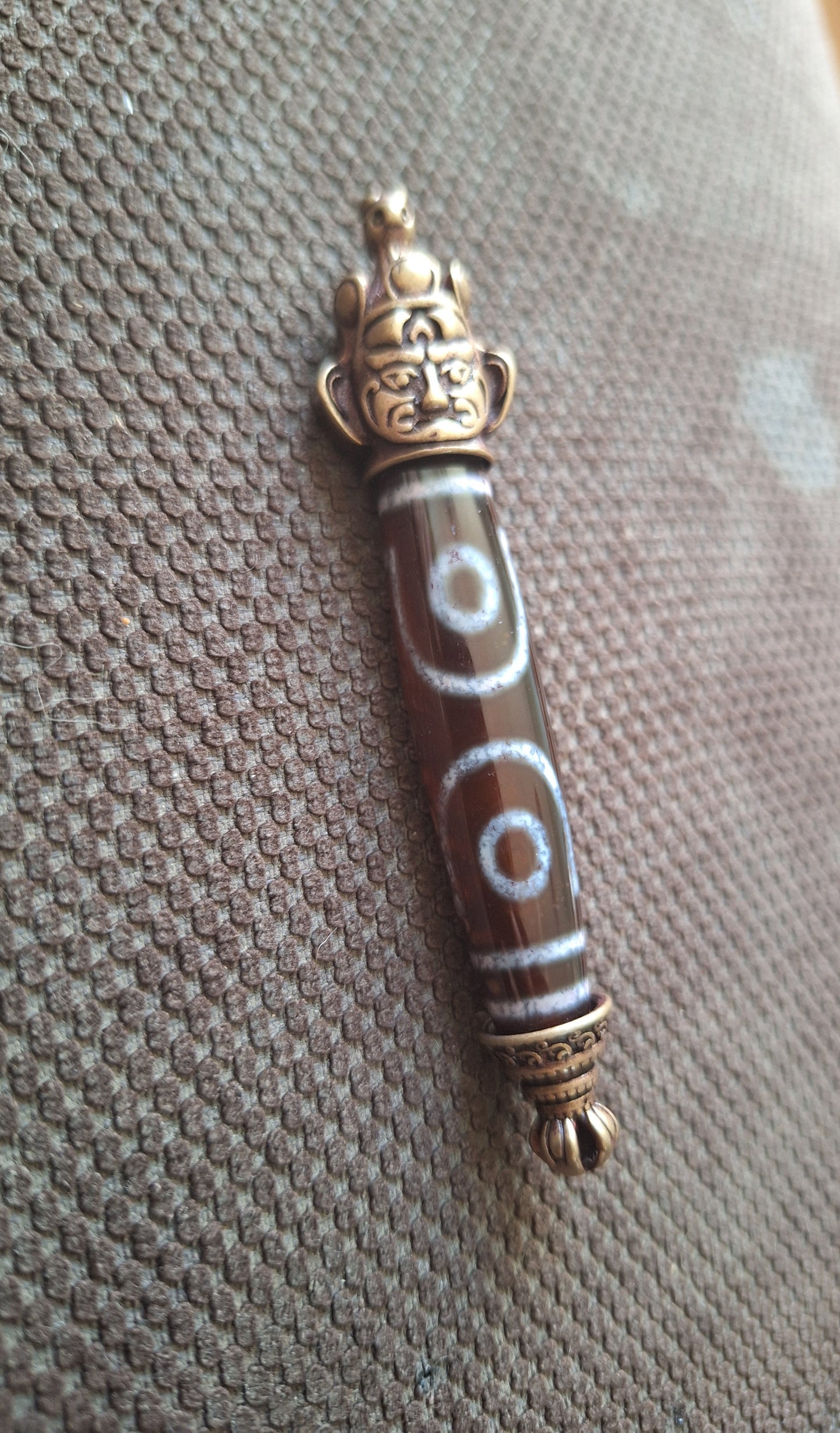 3 eye dzi bead and Hayagriva pendant