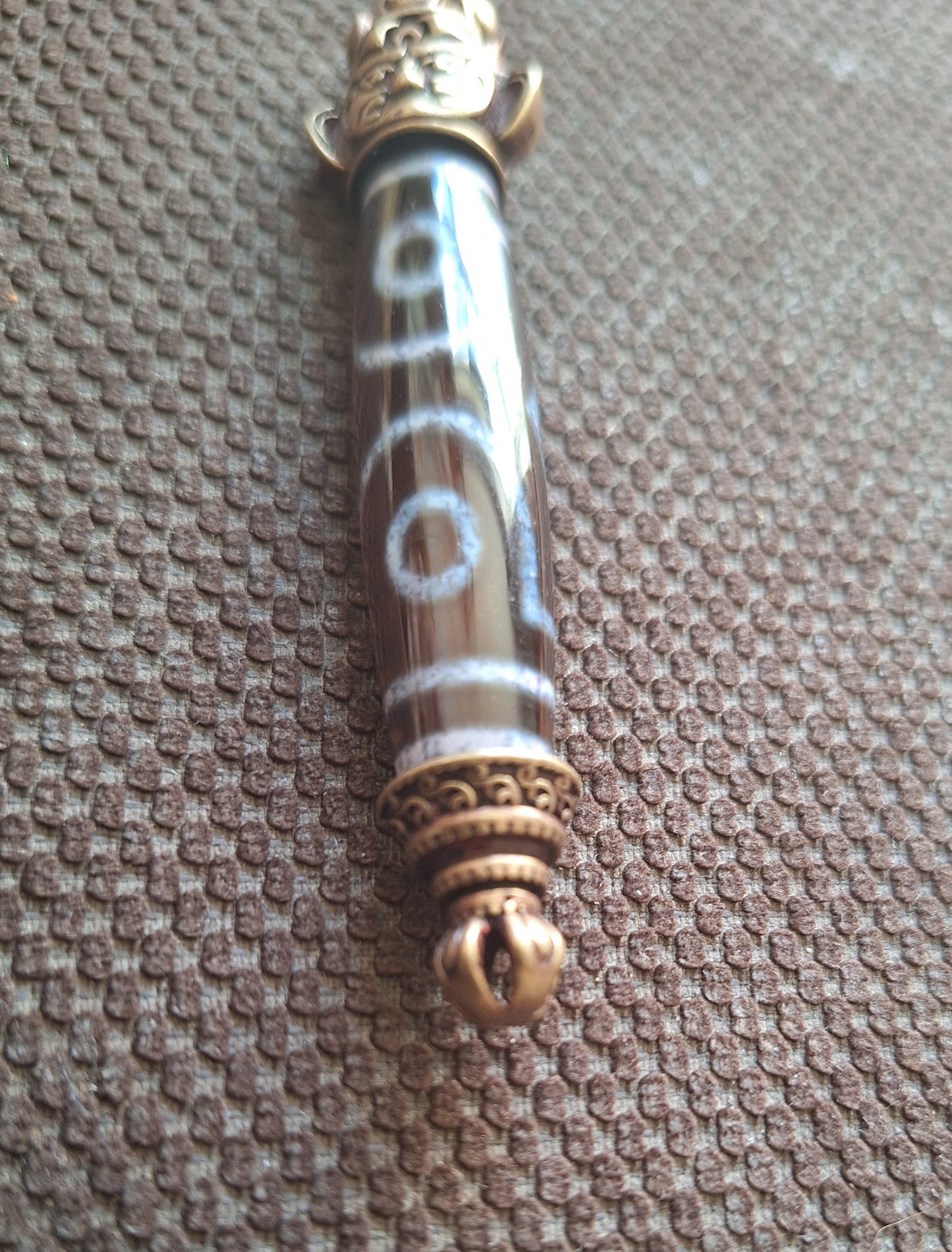 3 eye dzi bead and Hayagriva pendant