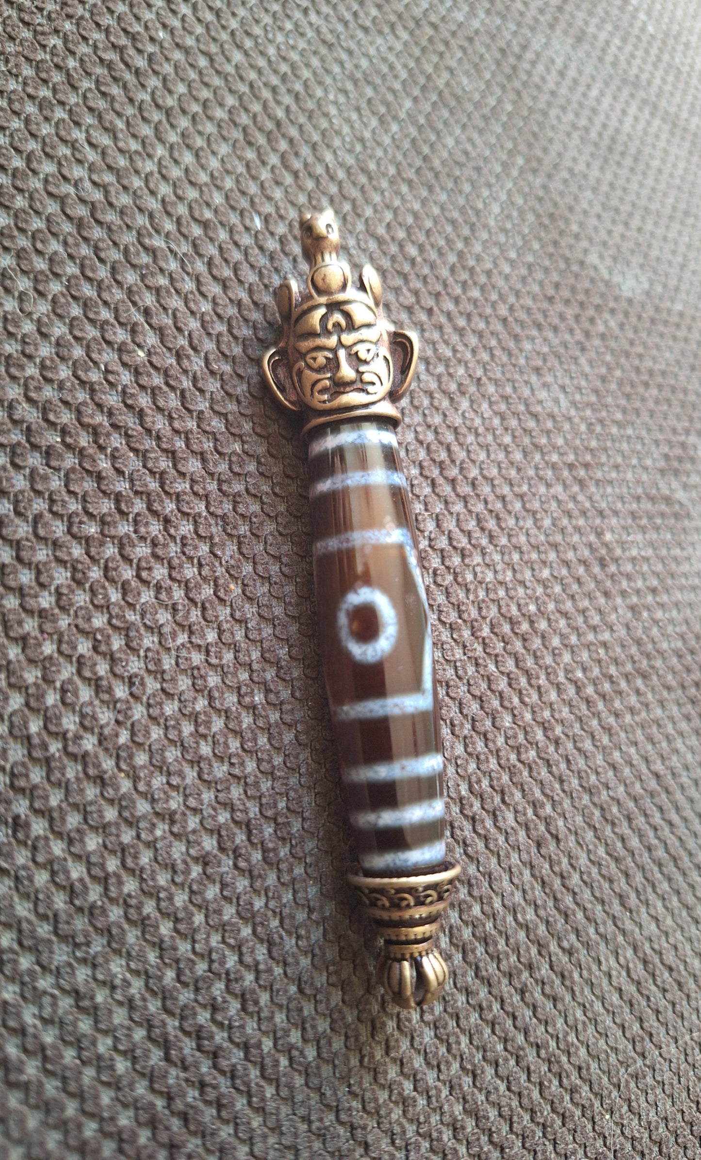 3 eye dzi bead and Hayagriva pendant
