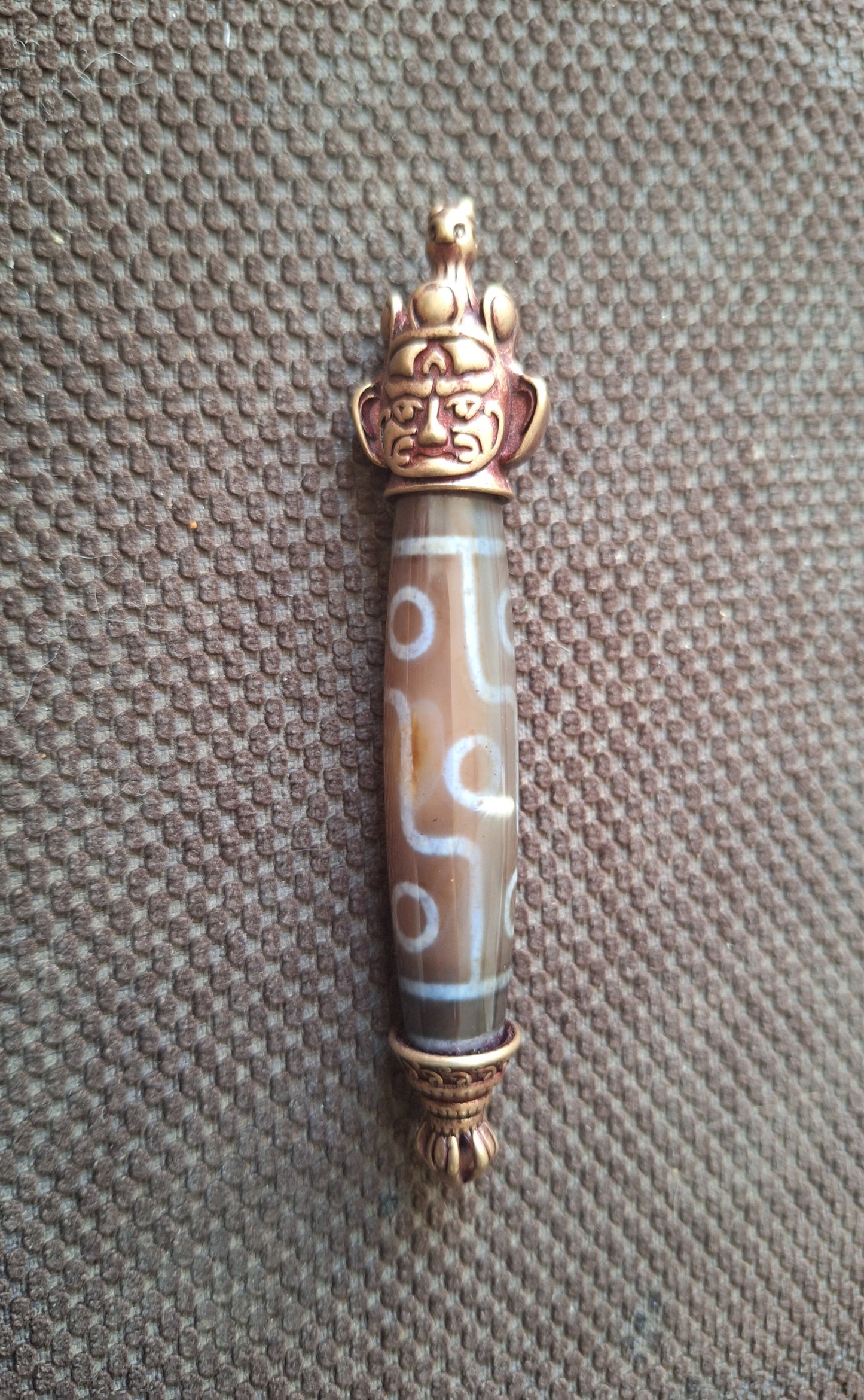9 eye dzi bead and Hayagriva pendant