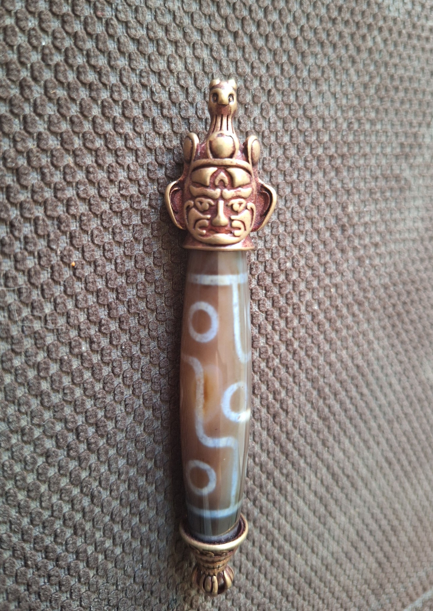 9 eye dzi bead and Hayagriva pendant