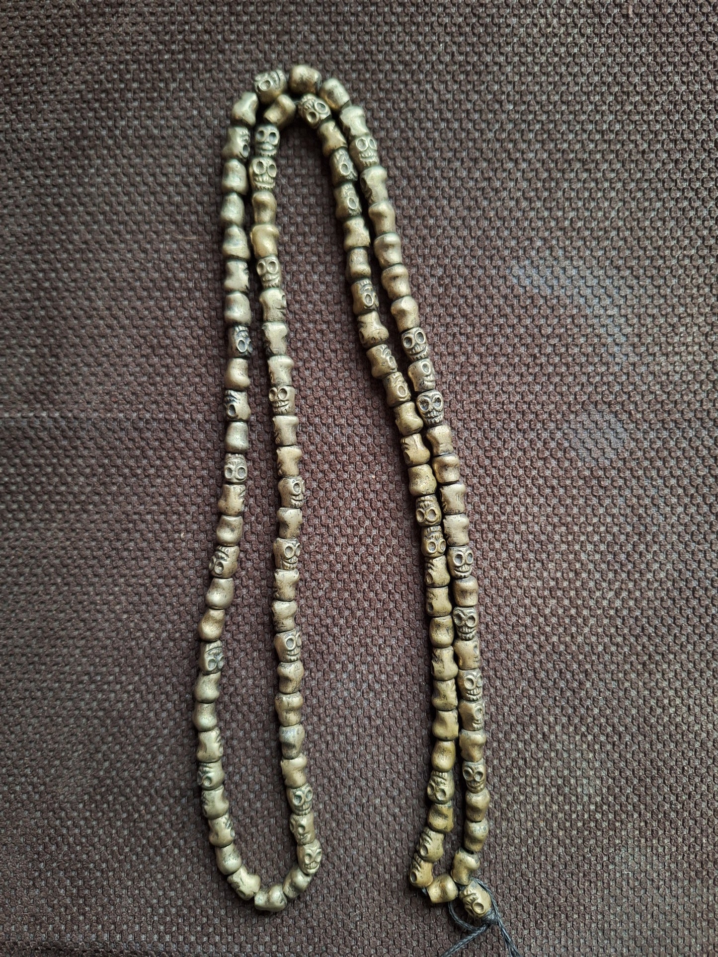 Vintage bronze skull mala