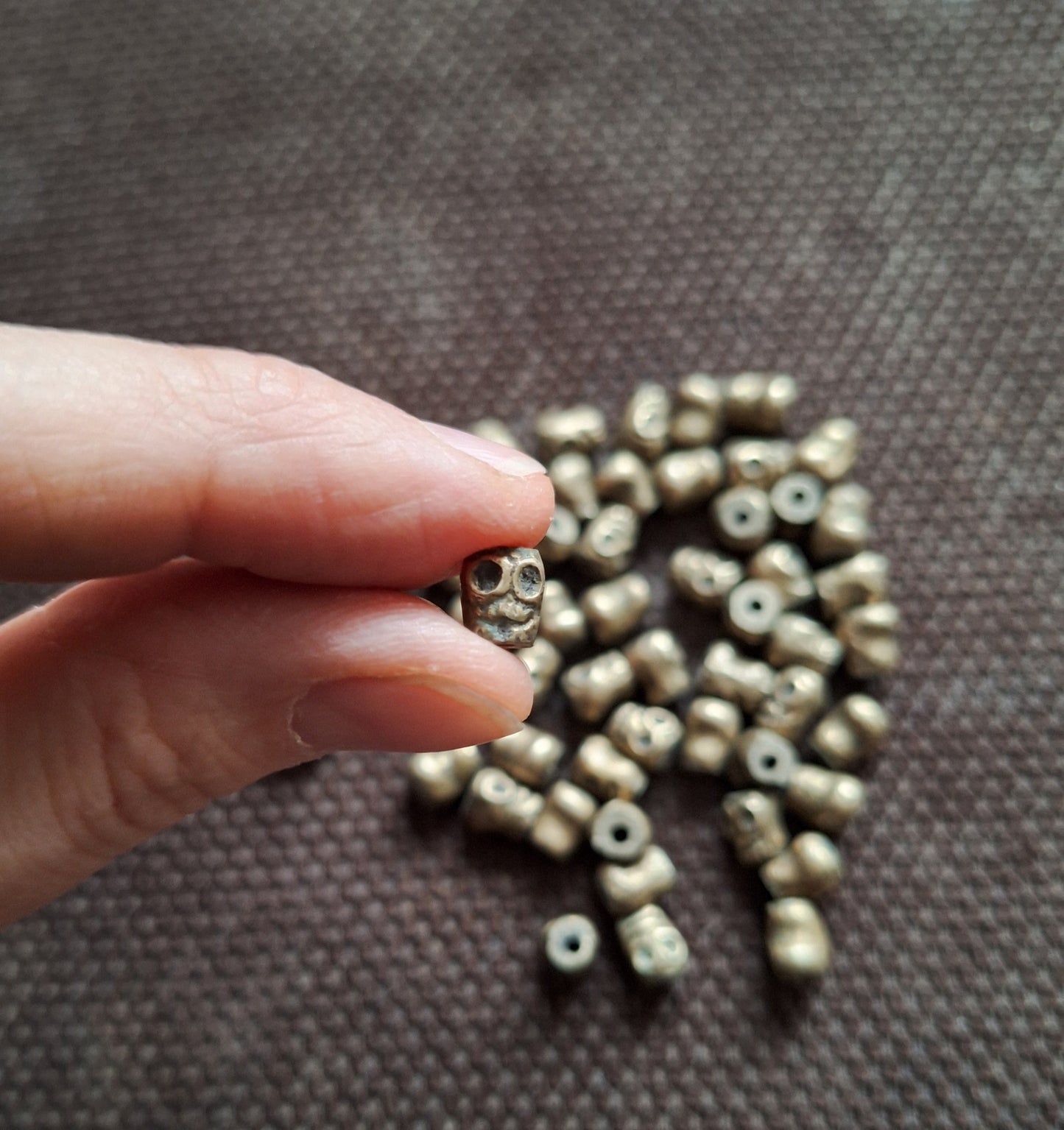 Vintage bronze skull beads, set of 10