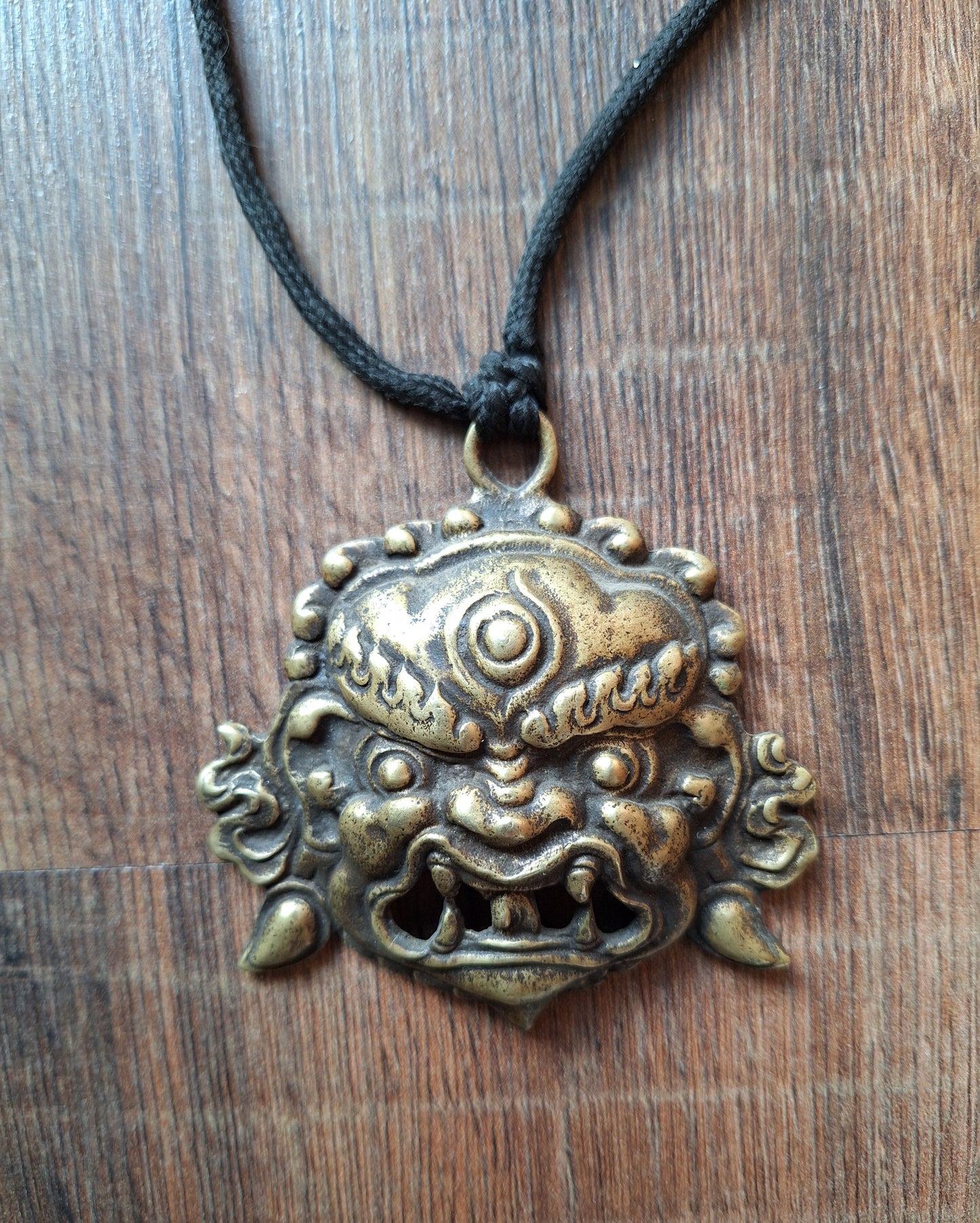 Vintage bronze Angry Deity pendant