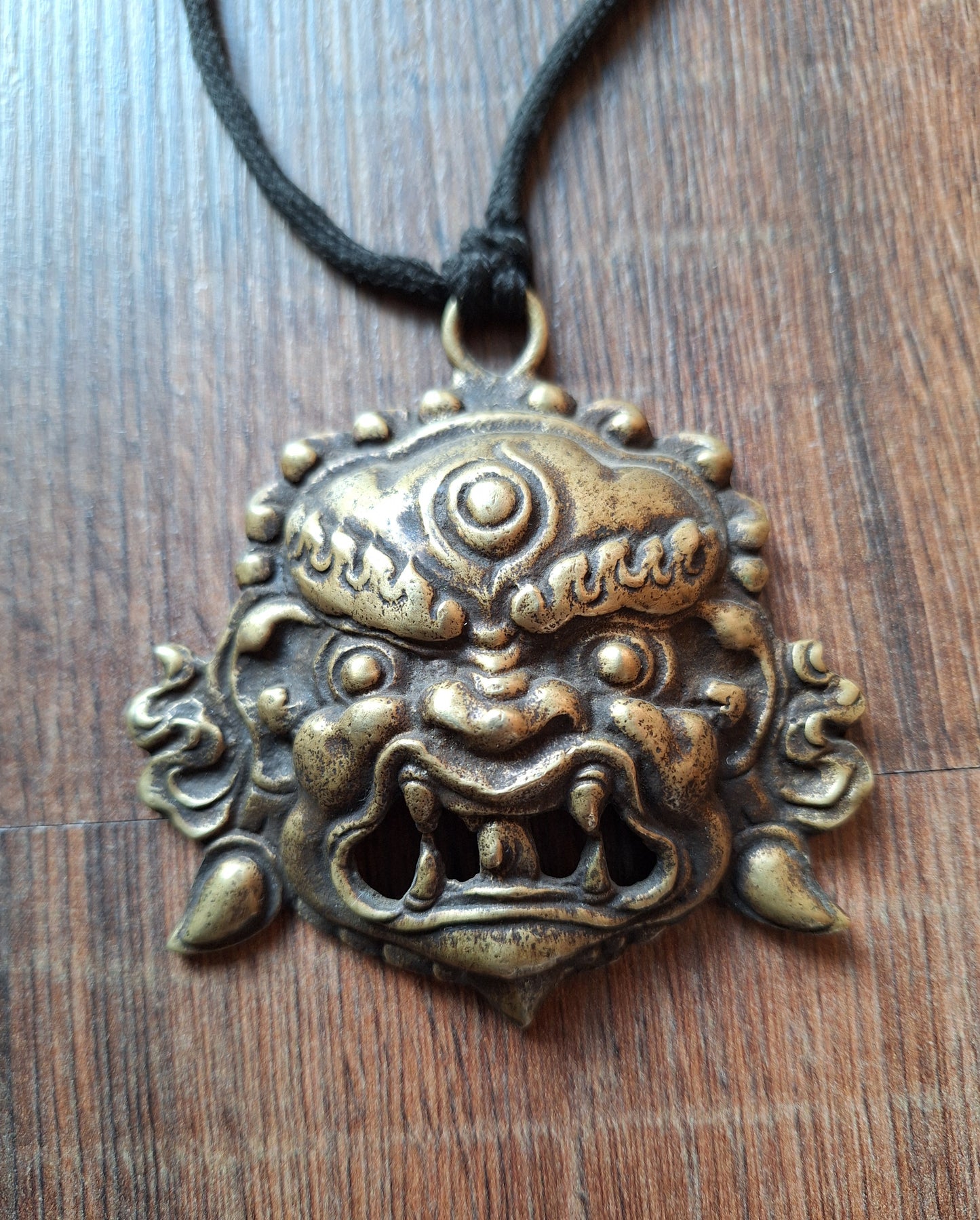 Vintage bronze Angry Deity pendant