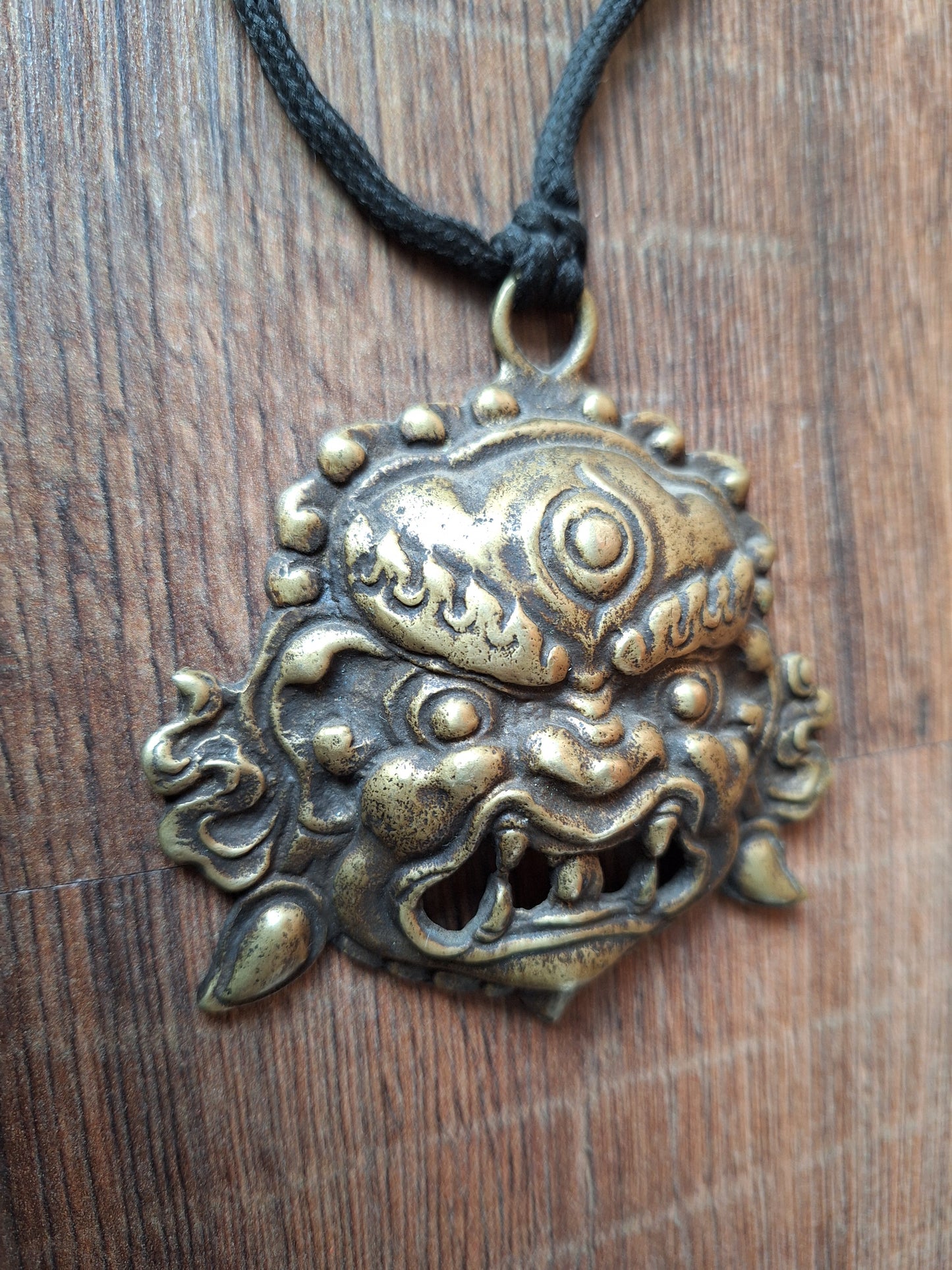 Vintage bronze Angry Deity pendant