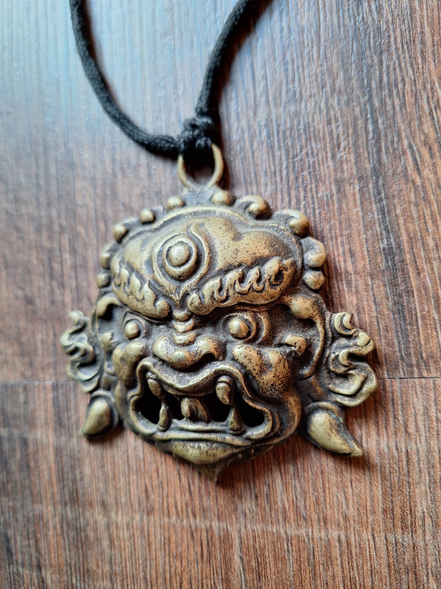 Vintage bronze Angry Deity pendant