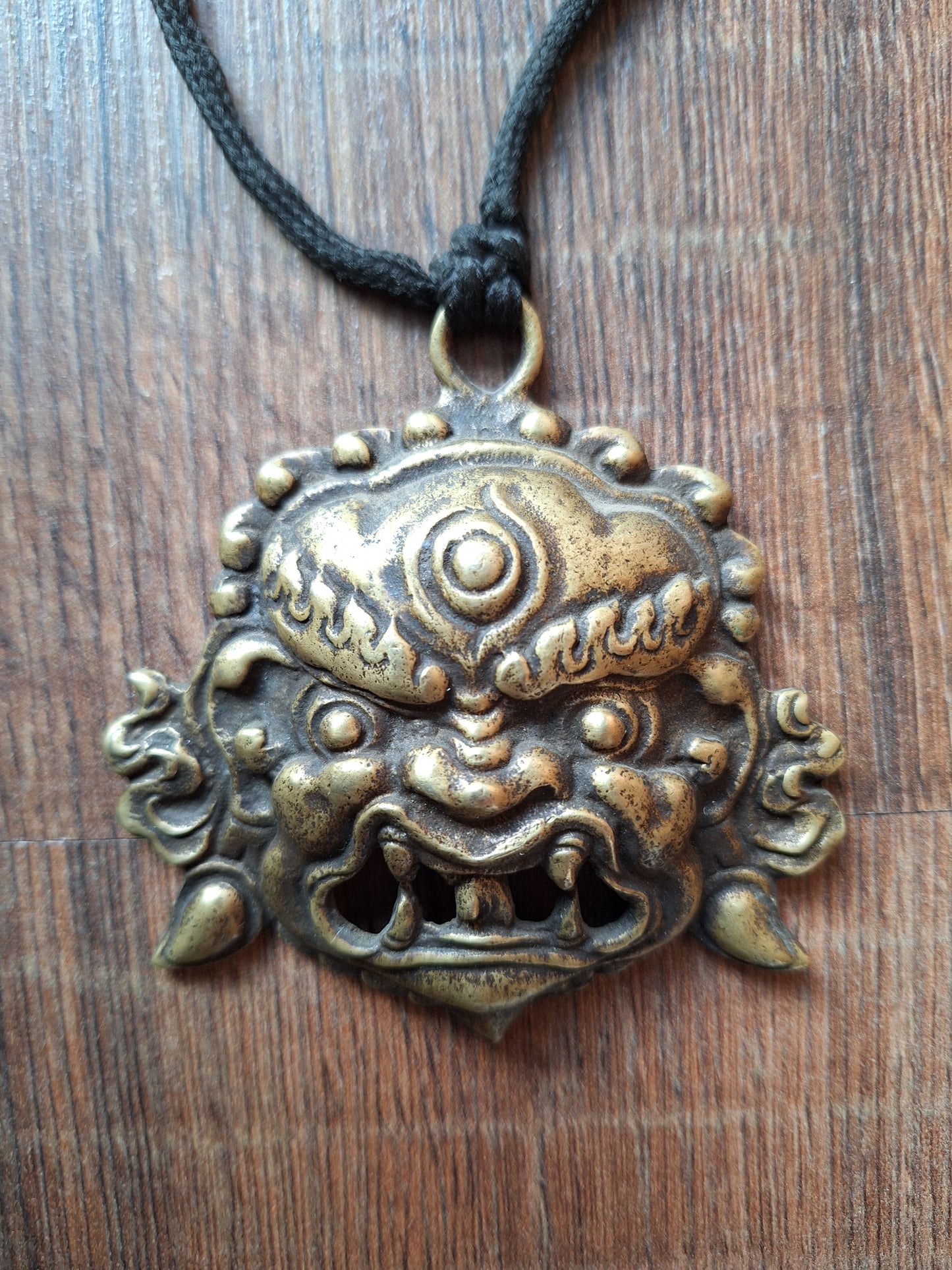 Vintage bronze Angry Deity pendant