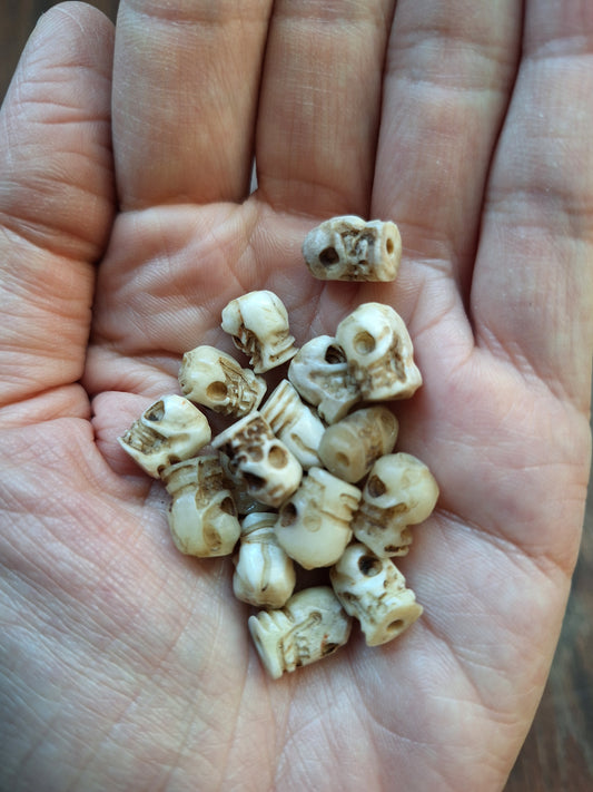 Old bone carved skull beads, set of 17