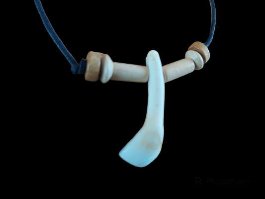 Cow tooth amulet necklace