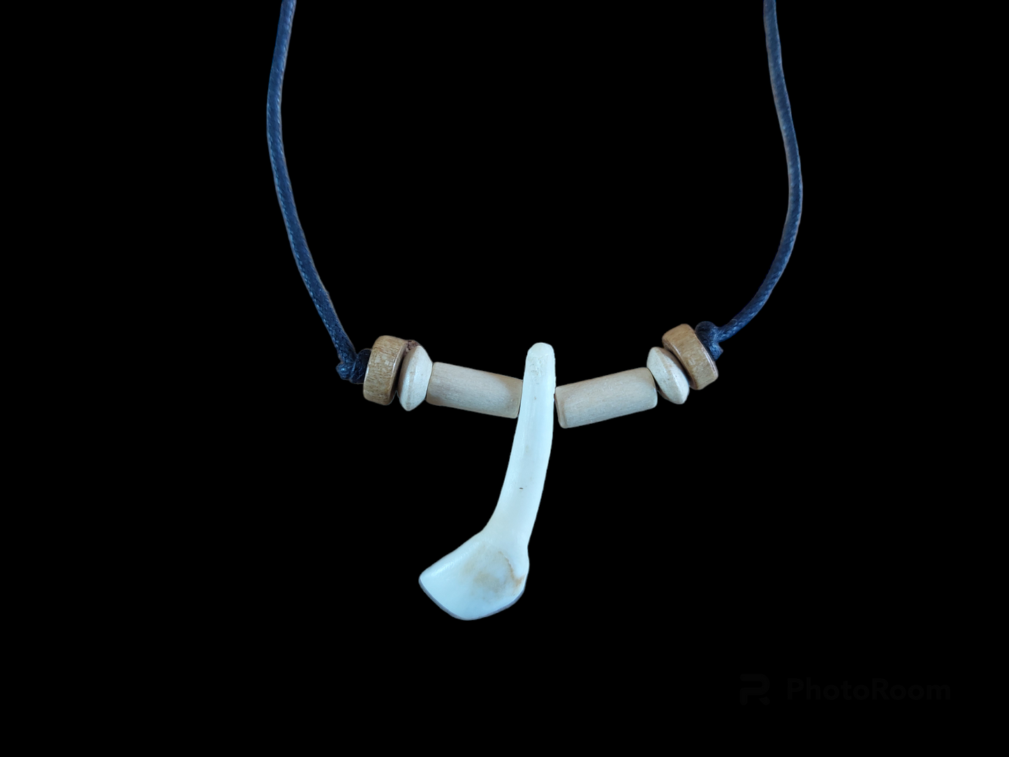 Cow tooth amulet necklace