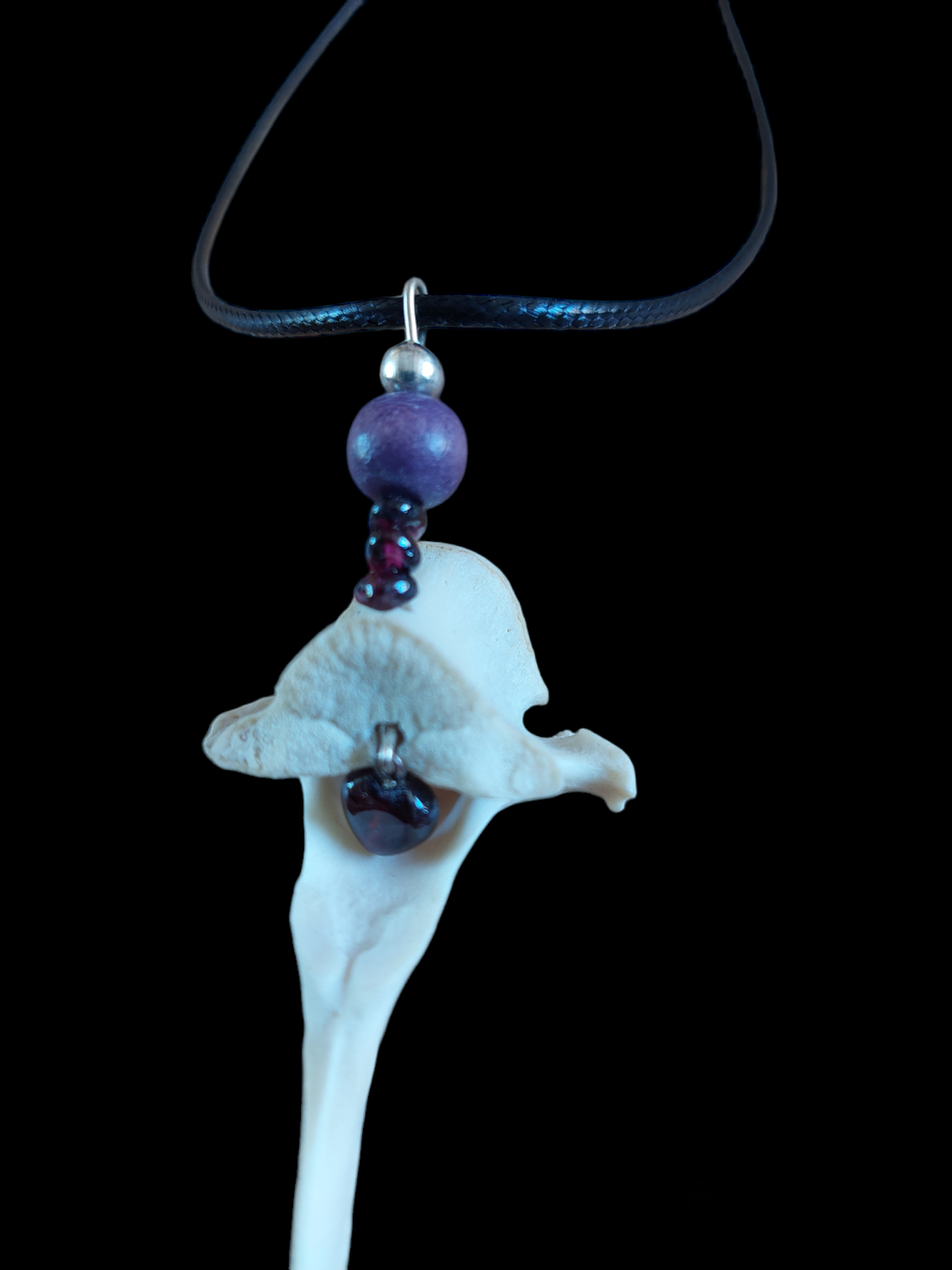 Roe deer vertebra and garnet amulet necklace