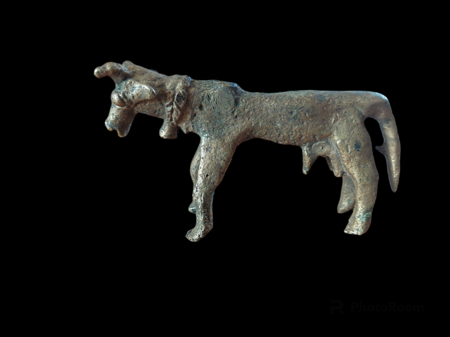 Antique cow figurine