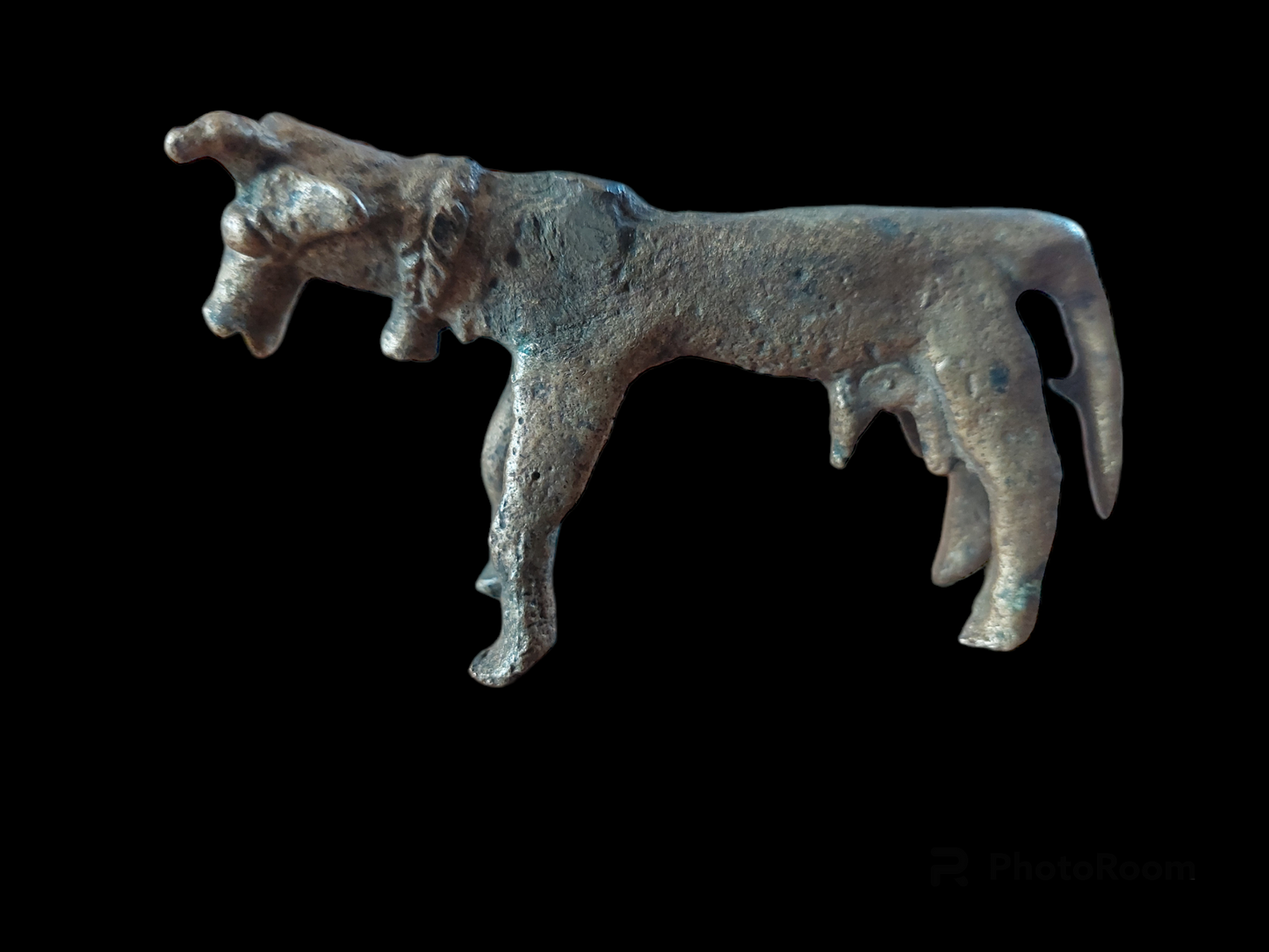 Antique cow figurine