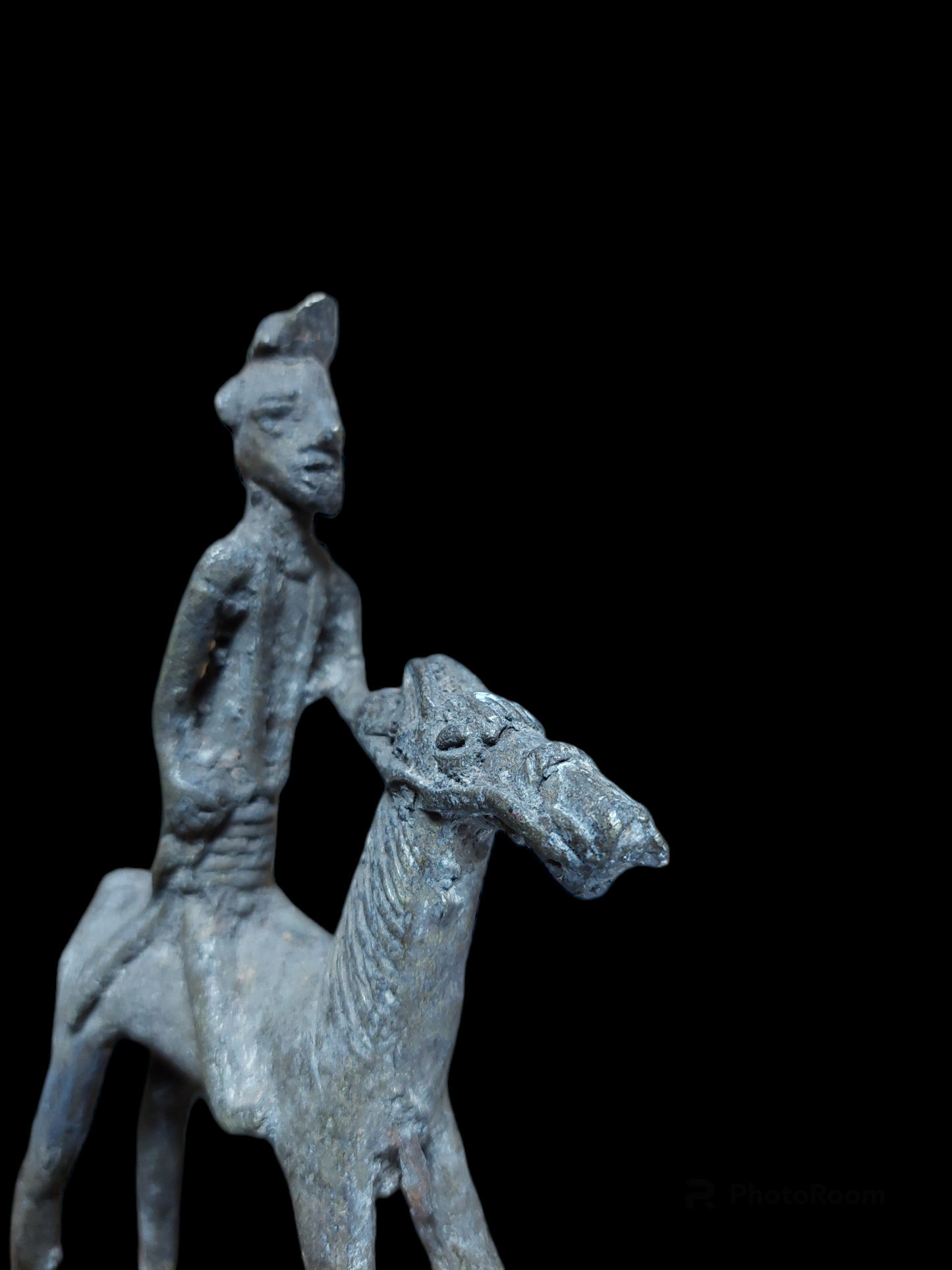 Antique figurine of a warrior on horse