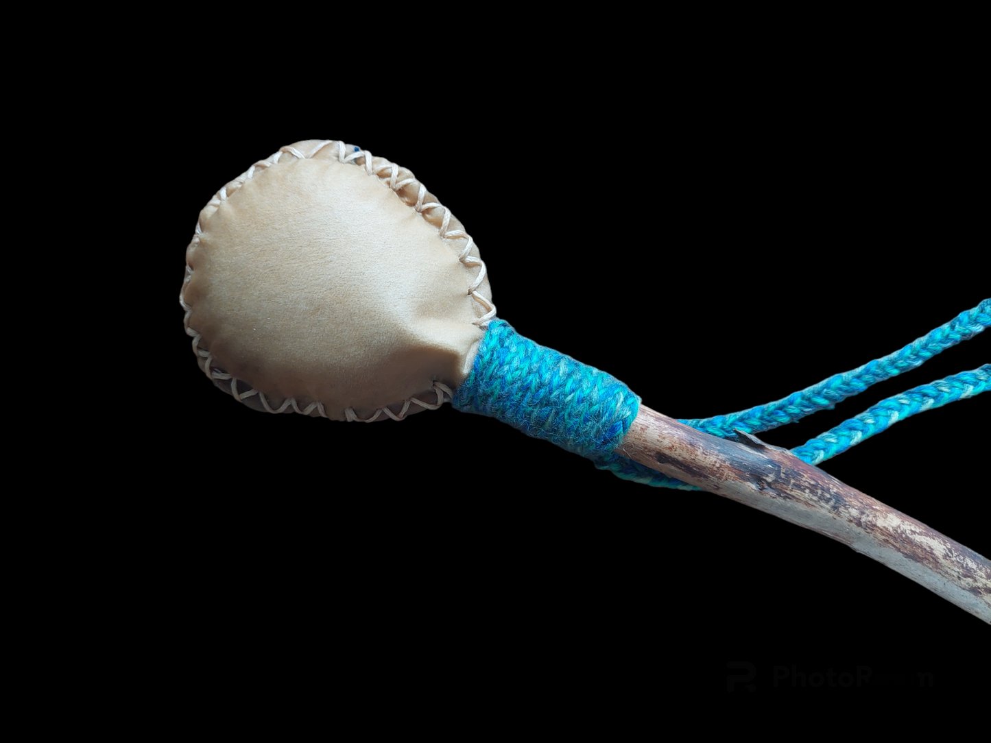 Goat hide and pine wood rattle