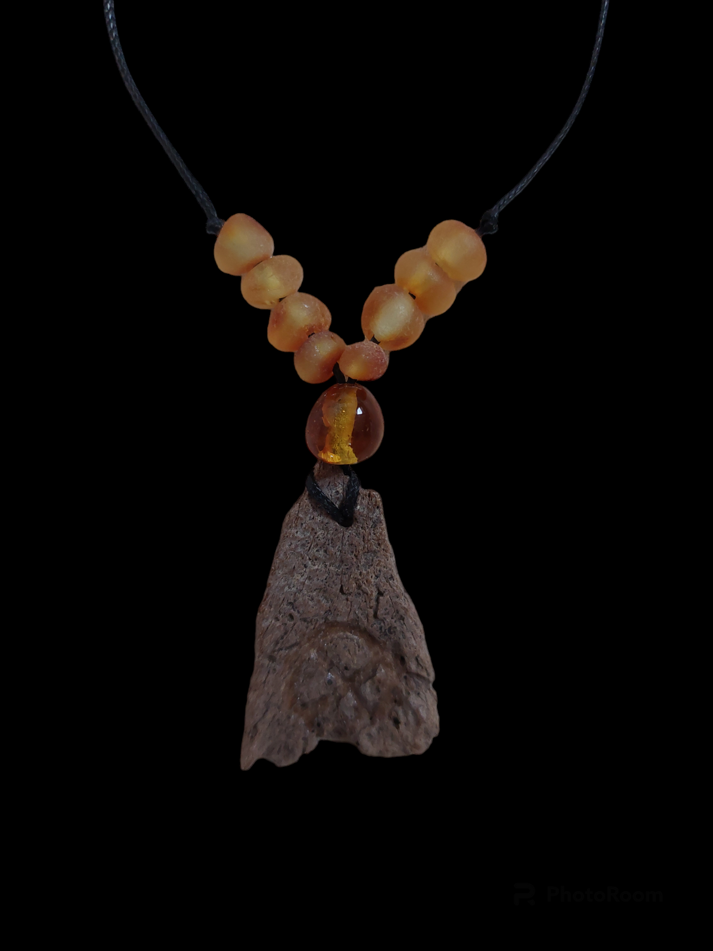 Engraved fossilized bone and amber amulet necklace #1