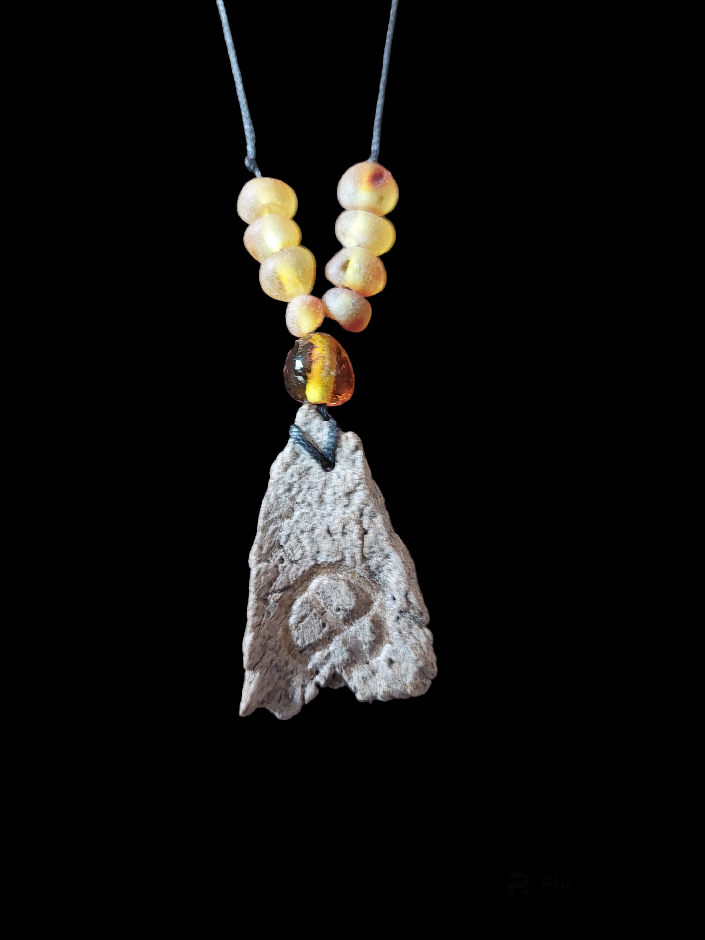 Engraved fossilized bone and amber amulet necklace #1