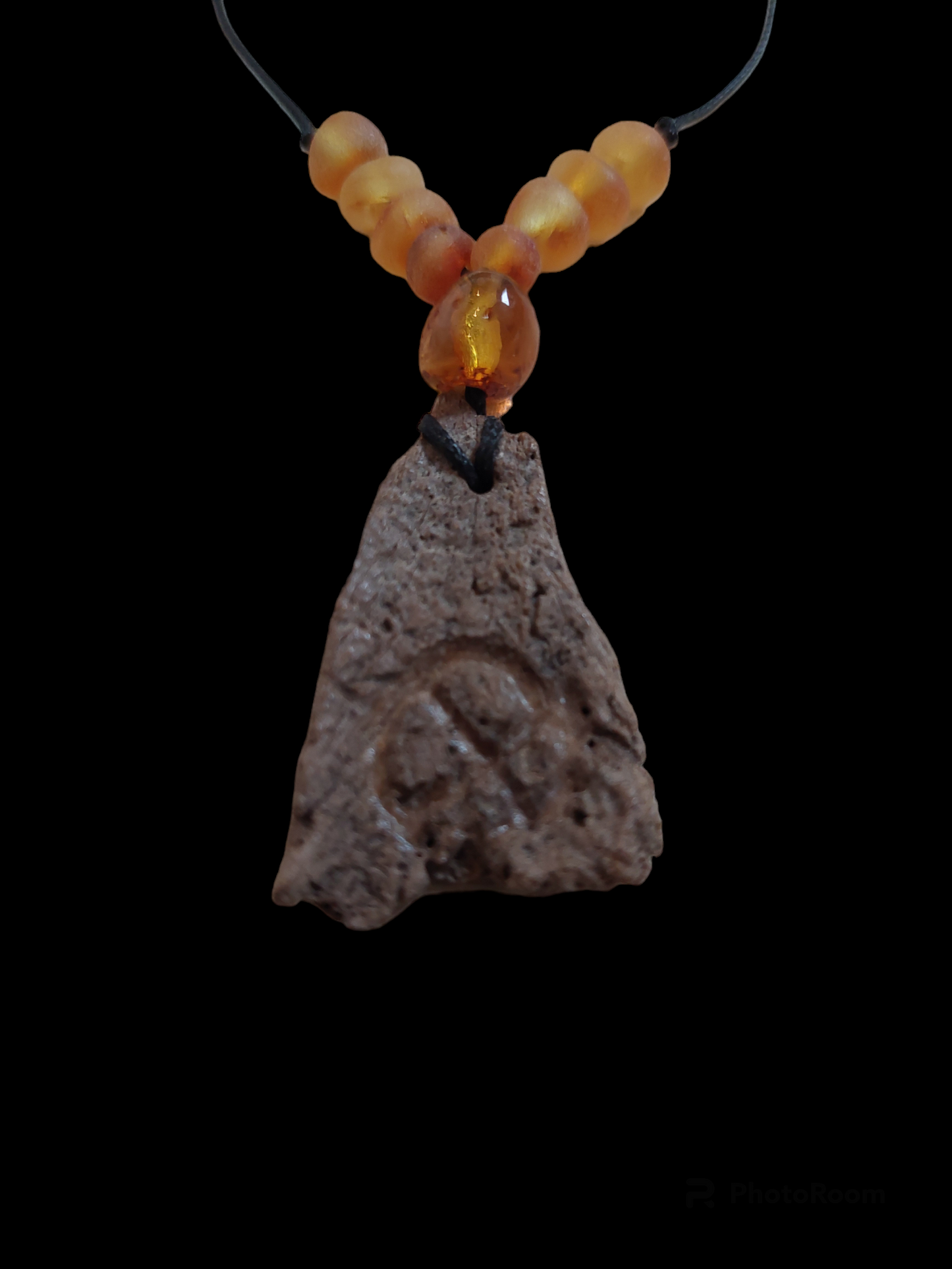 Engraved fossilized bone and amber amulet necklace #1