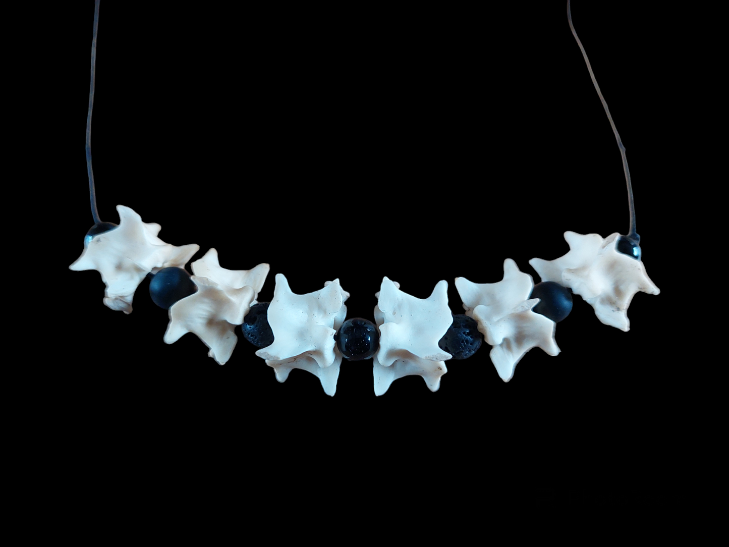 Constrictor snake vertebrae with obsidian and lava stone amulet necklace