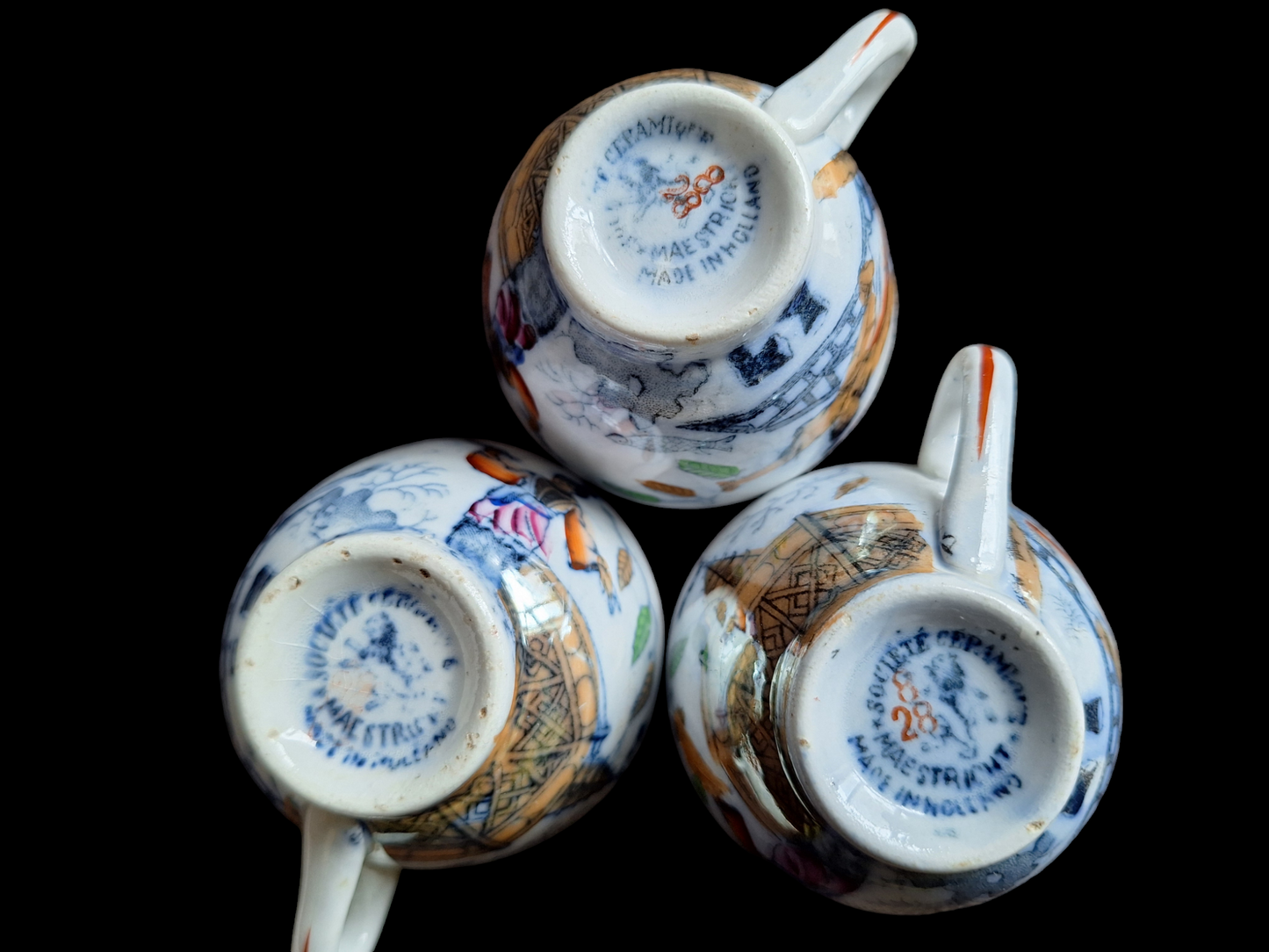 Antique Dutch lusterware cups and saucers, set of 3