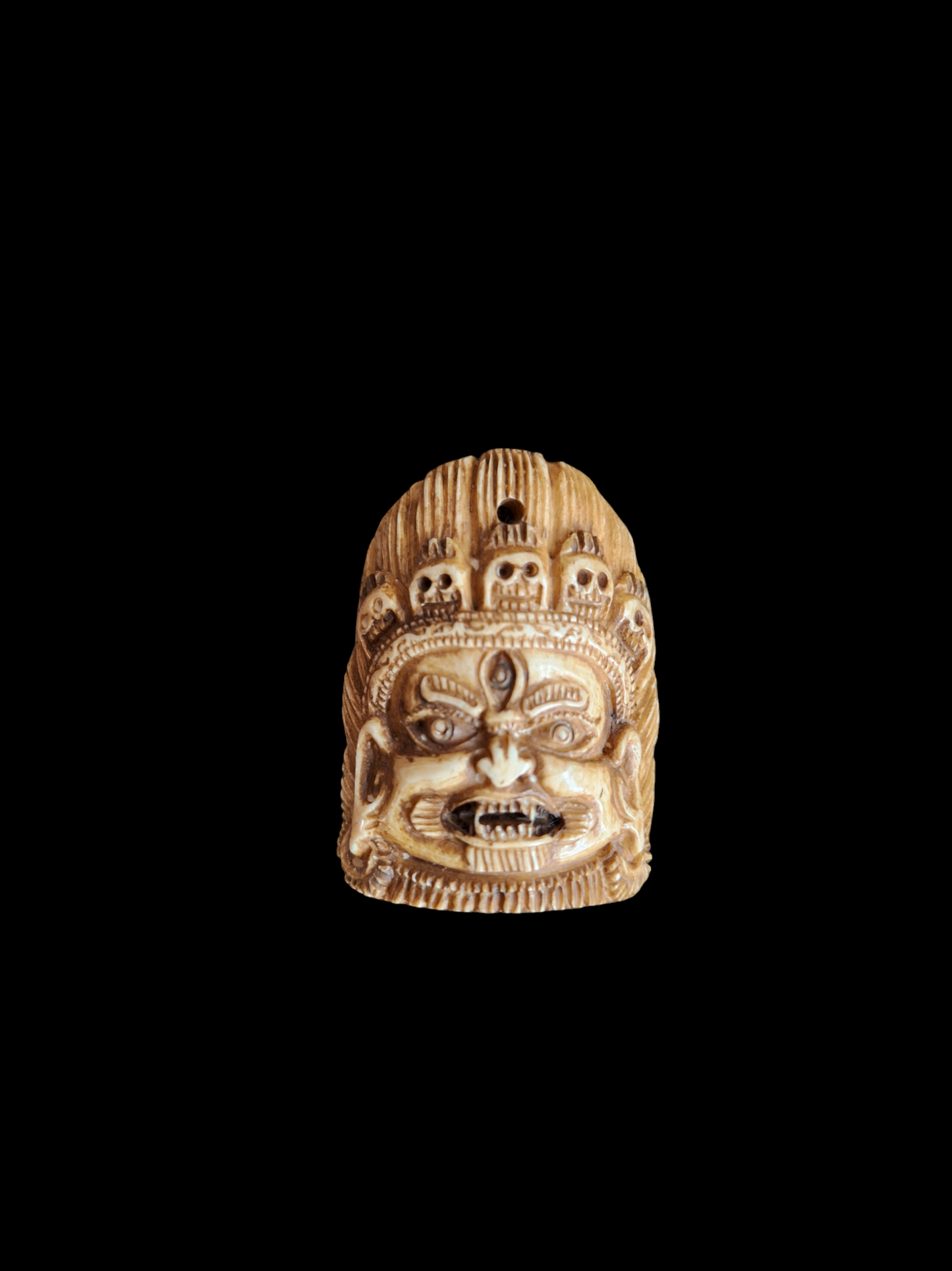 Bone carved Mahakala pendant #1