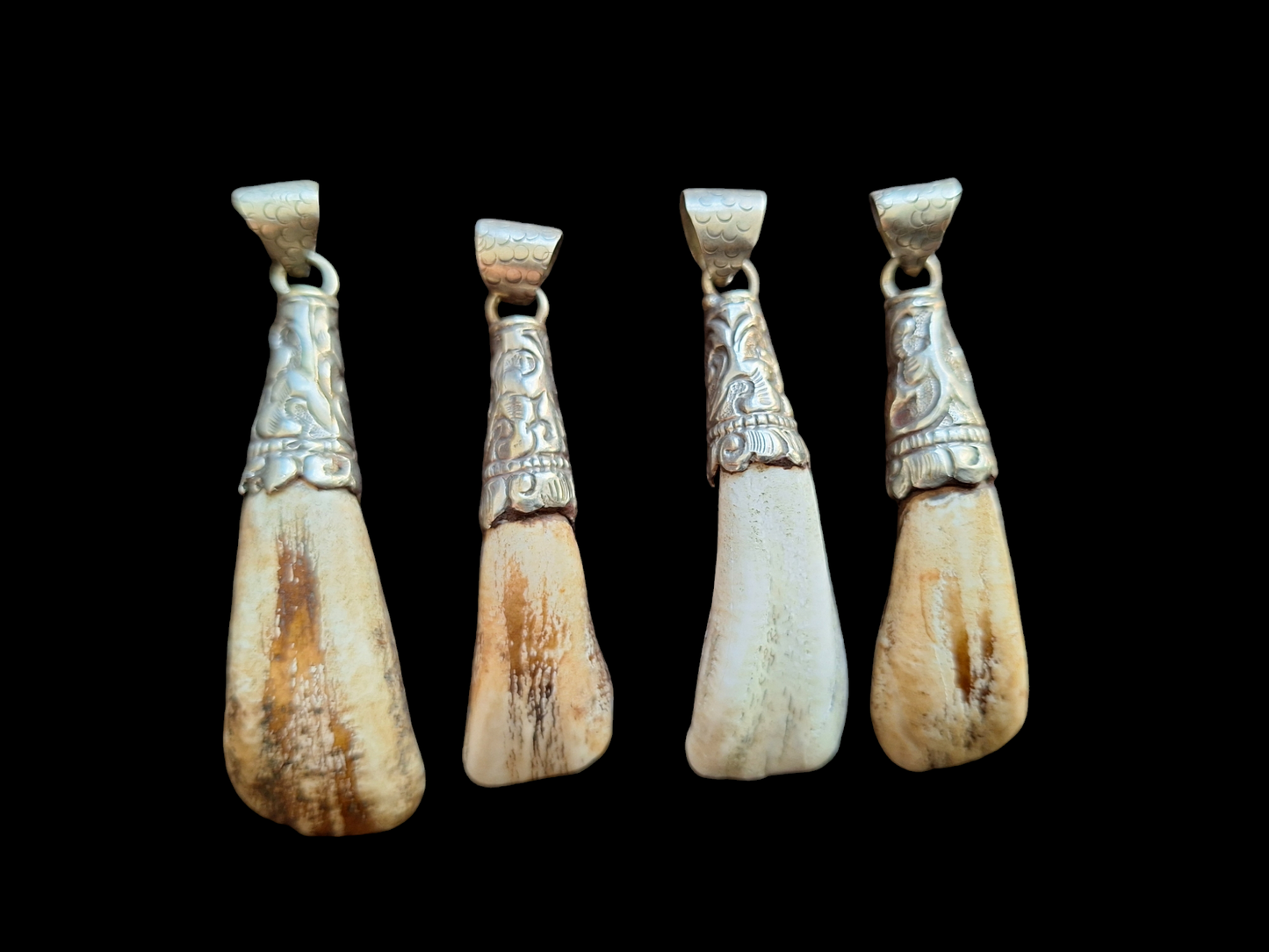 Vintage Nepalese yak tooth pendants