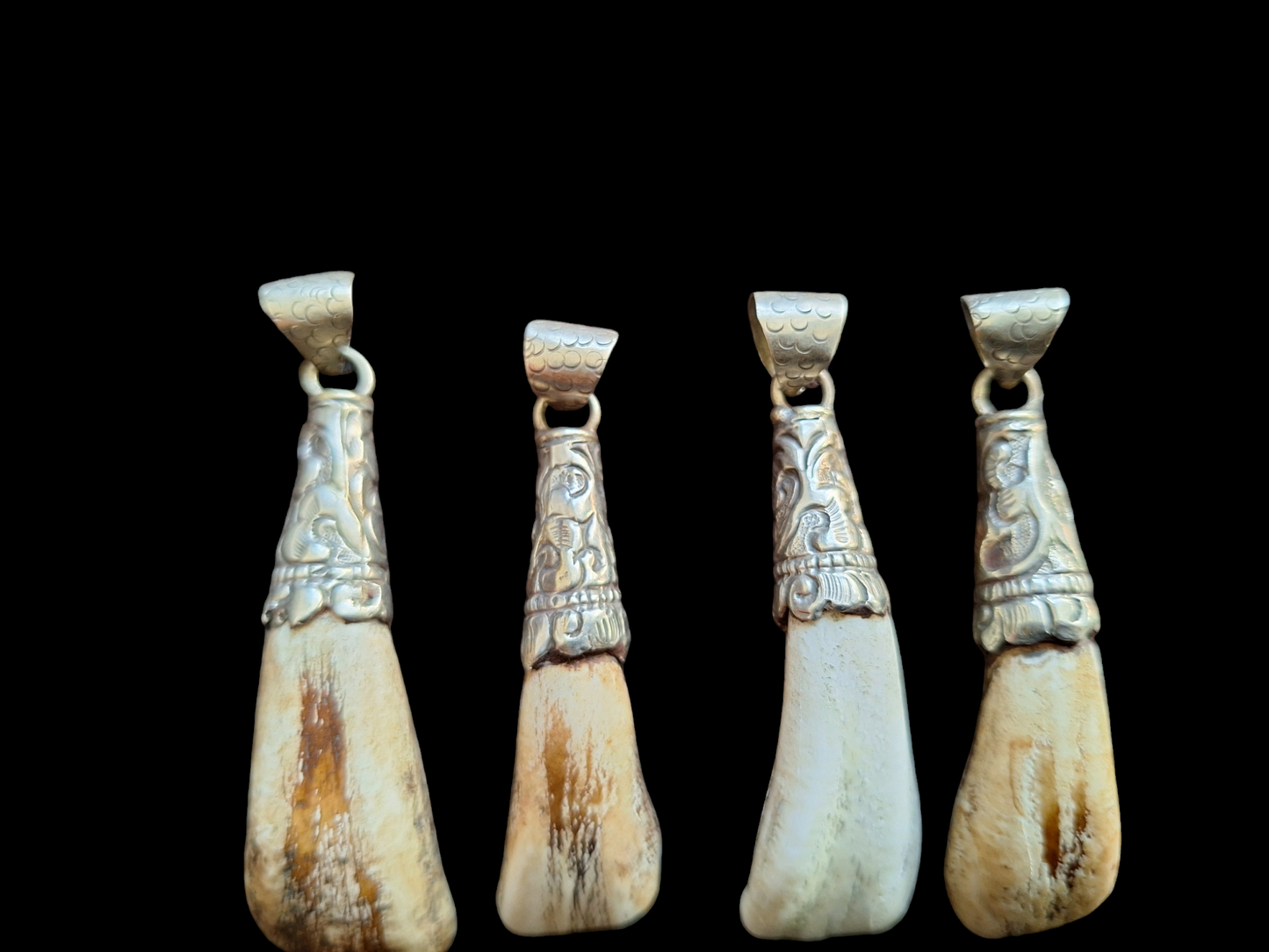 Vintage Nepalese yak tooth pendants