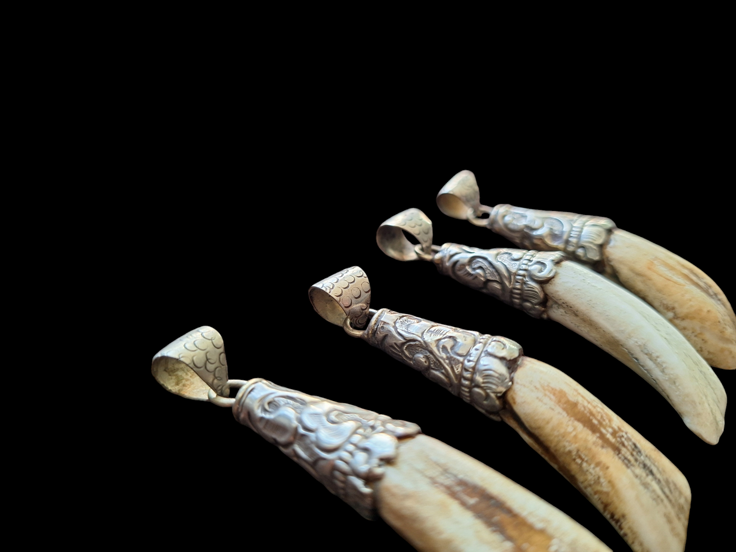 Vintage Nepalese yak tooth pendants