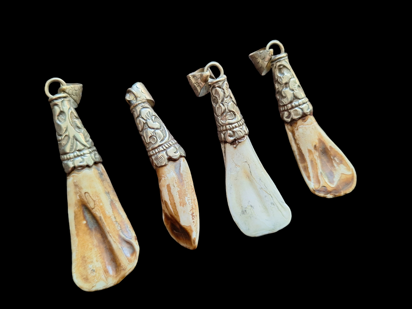 Vintage Nepalese yak tooth pendants