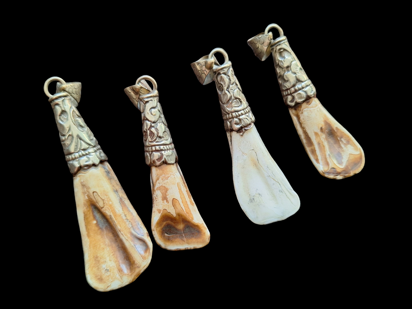 Vintage Nepalese yak tooth pendants