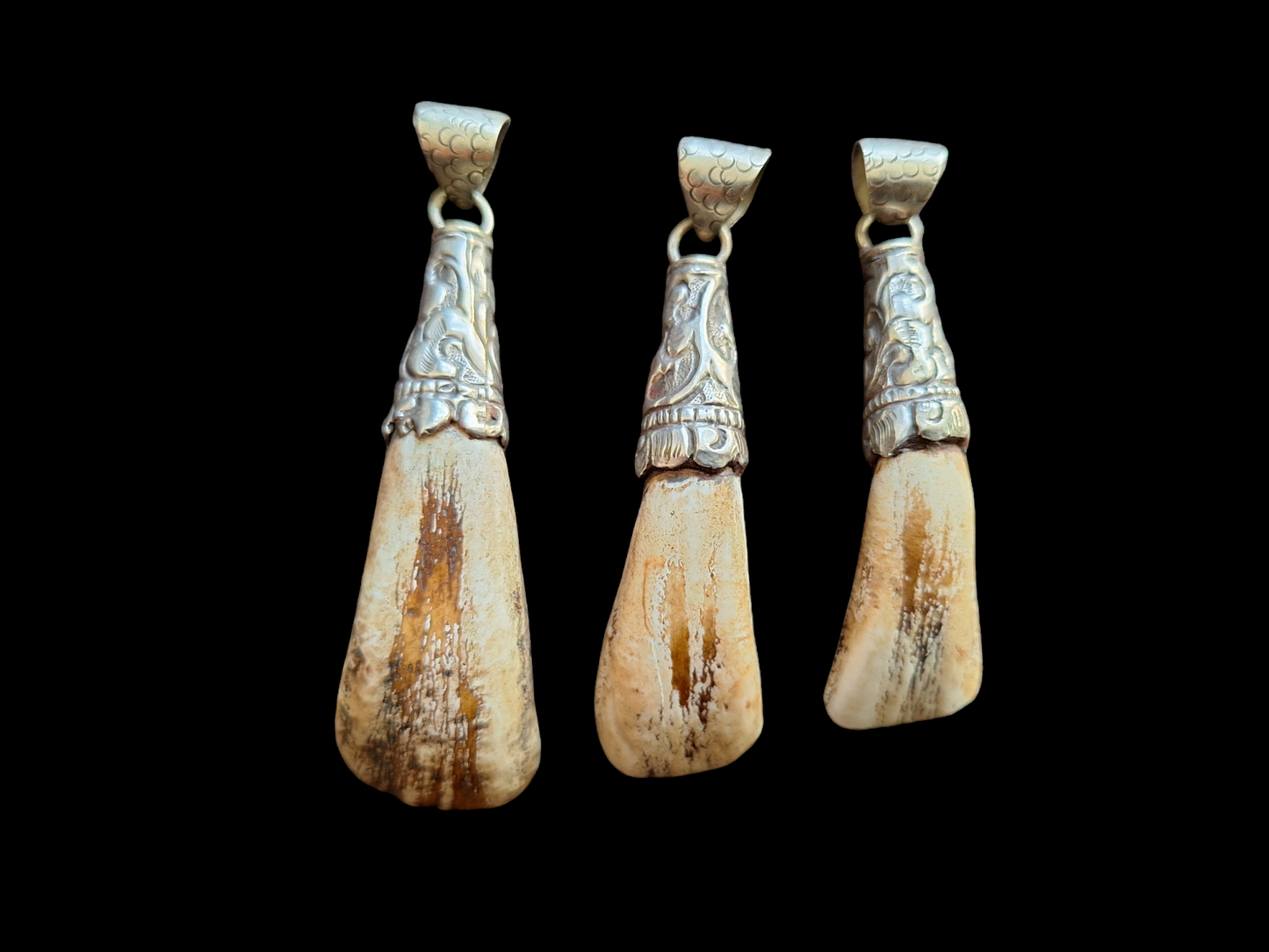 Vintage Nepalese yak tooth pendants