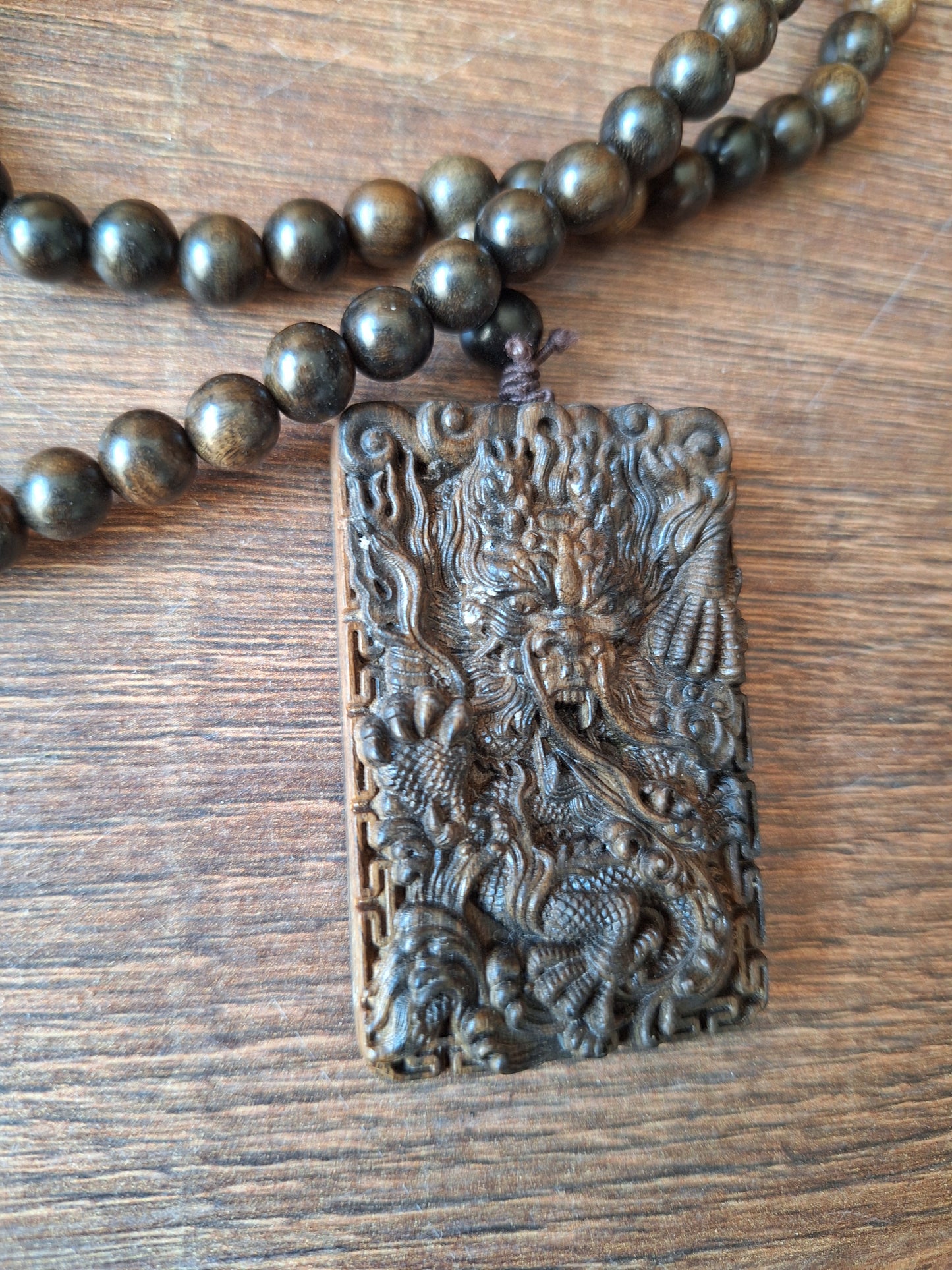Agarwood mala with dragon pendant