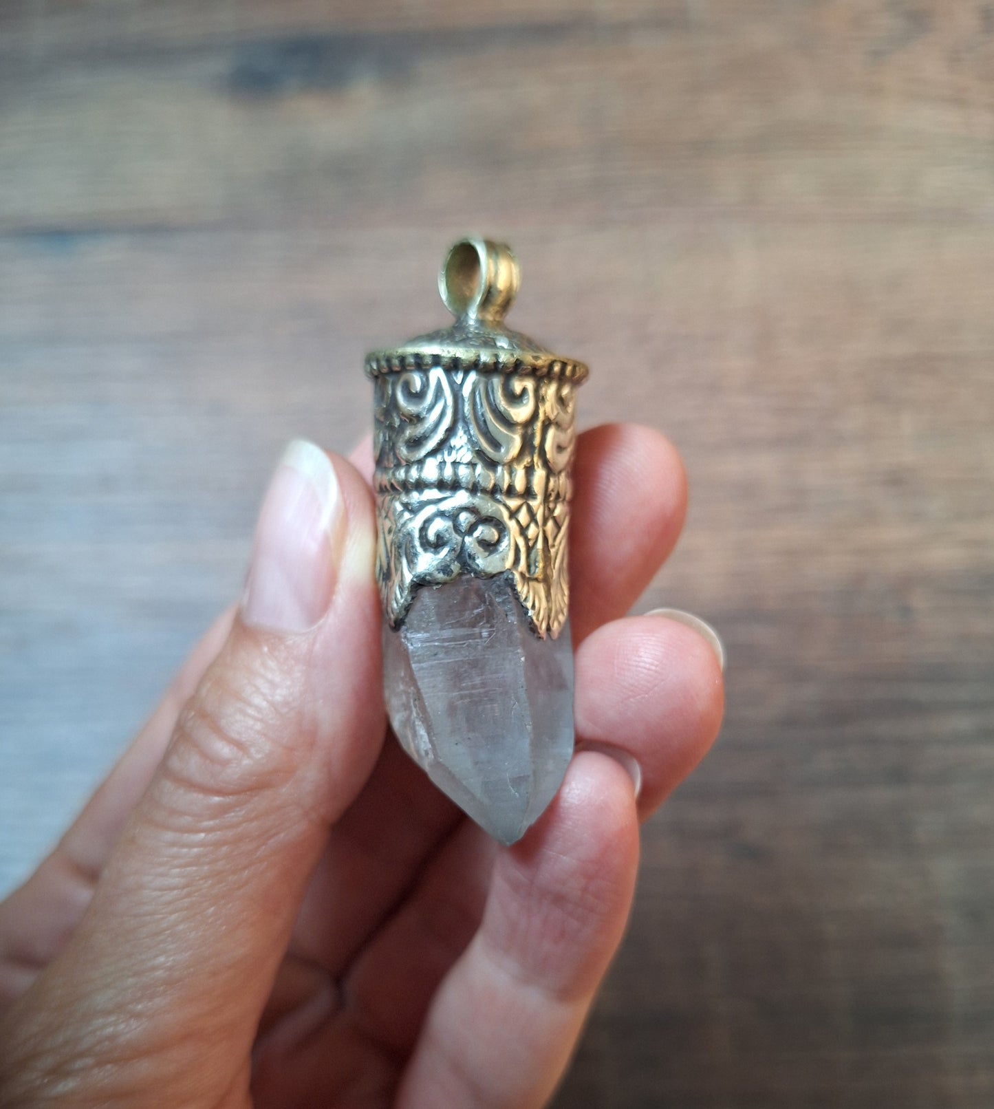 Vintage quartz crystal in Tibetan silver pendant