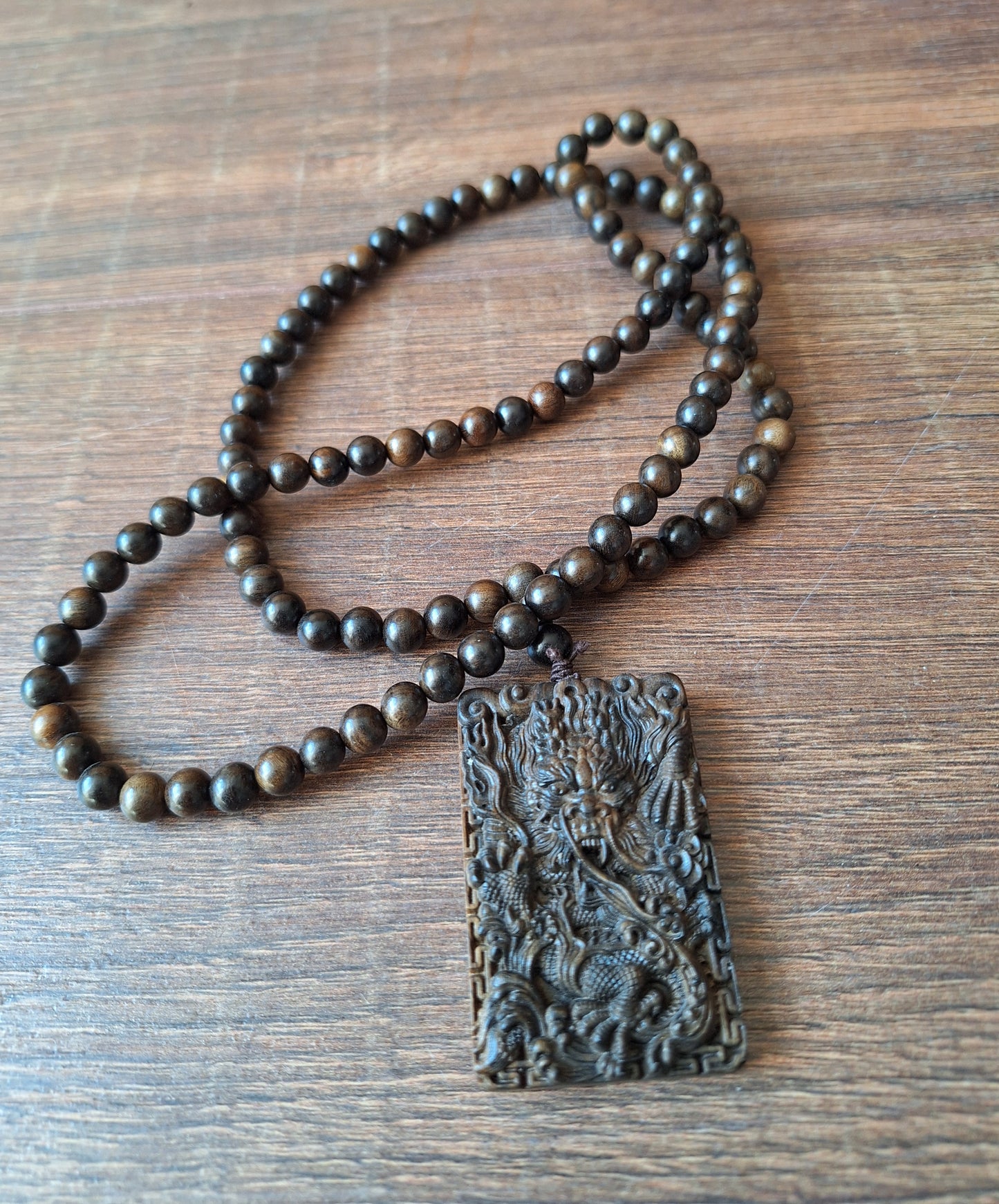 Agarwood mala with dragon pendant