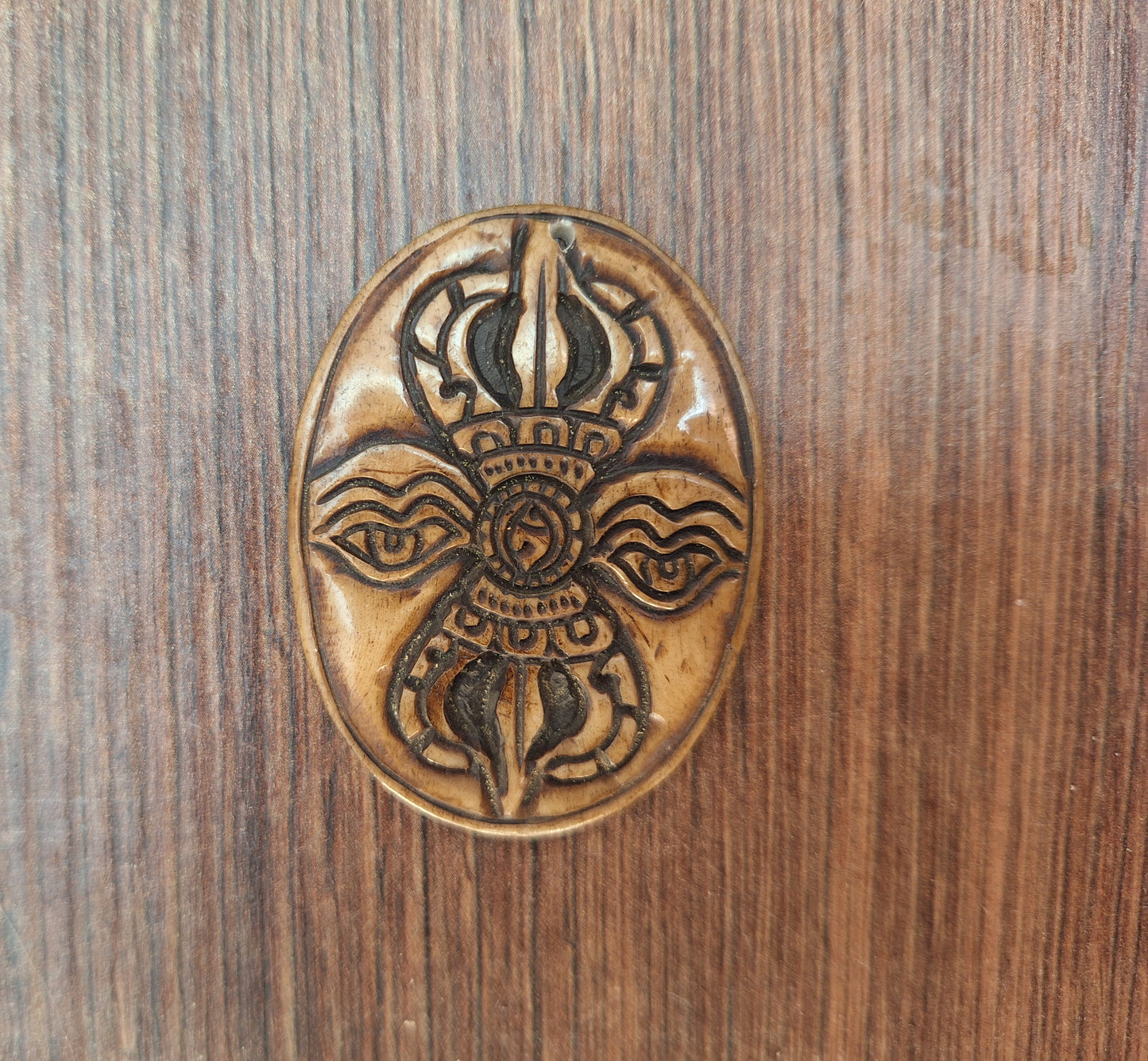 Vintage yak bone pendant Dorje with Buddha Eyes