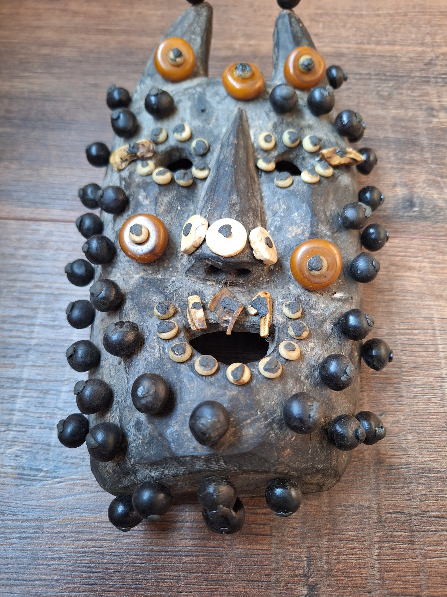 Old Nepalese wooden mask with rita, copal and shell beads